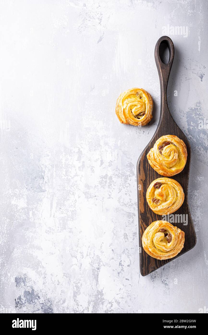 Sweet swirl buns with raisins for breakfast Stock Photo