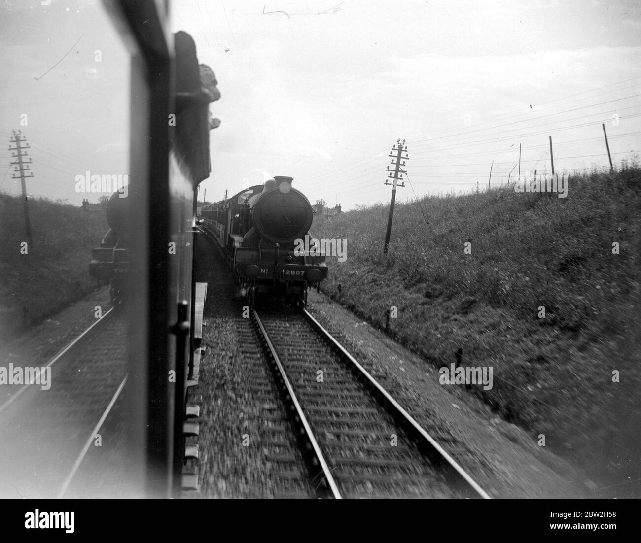 Two steam trains pass each other. 1933 Stock Photo