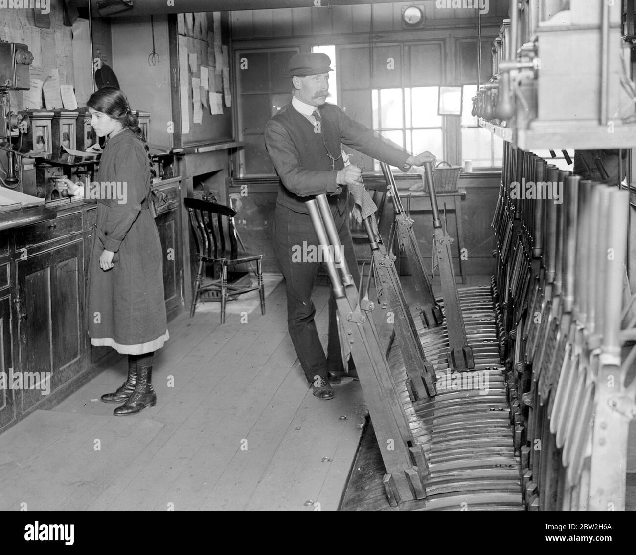 Fifteen year old Girl who helps her father as a telegraphist in the signal box at Hitchin. 21 March 1918 Stock Photo