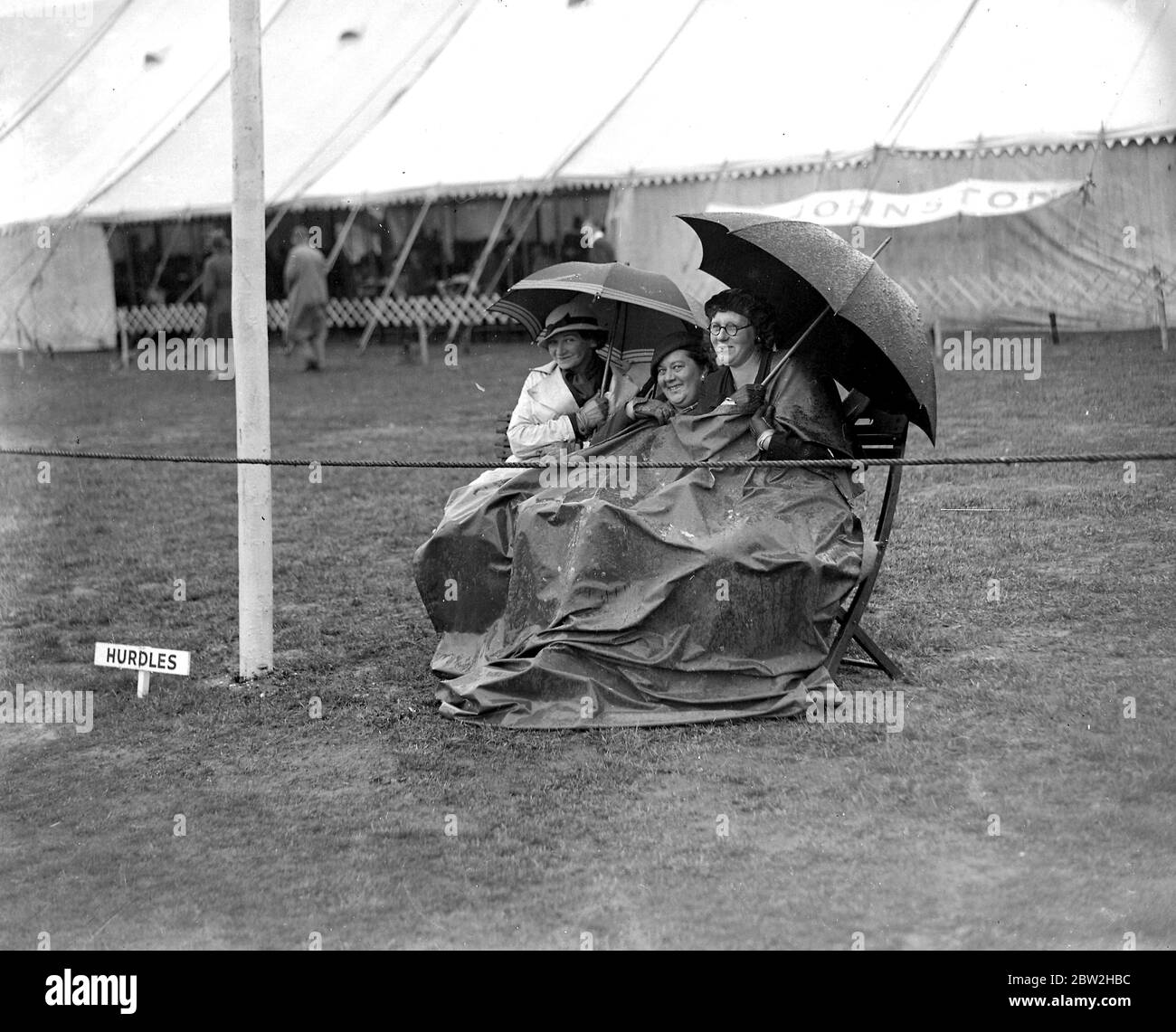 Keeping dry from rain. 1934 Stock Photo Alamy