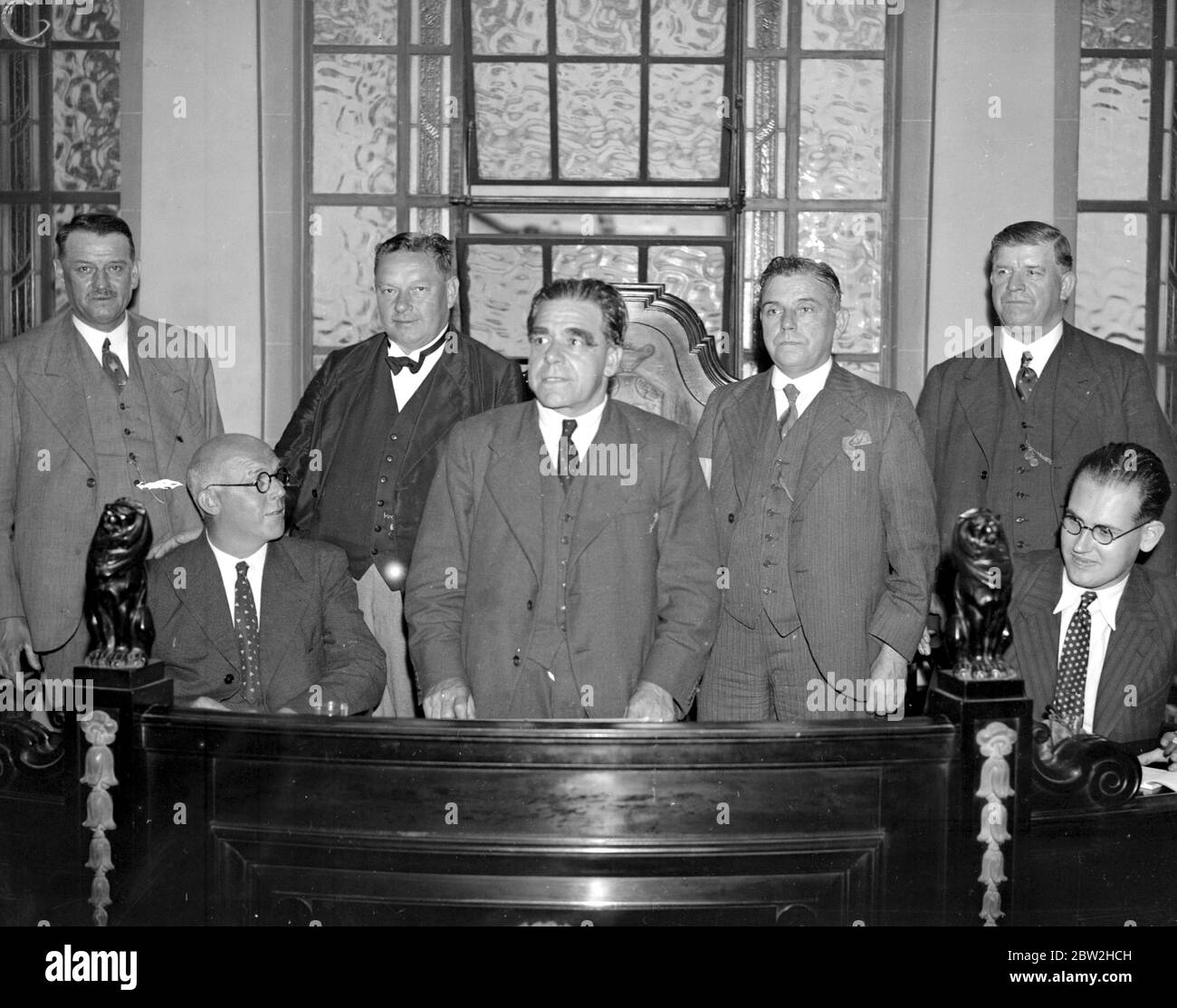 Building Trade Congress at Transport House. Back row, left to right:- Van Deth (Netherlands Building Workers Union), George Hicks, M.P., (Plumbers), J.W. Stephenson (N.F.B.T.O.) and Luke Fawcett (Building Trade Workers). Front Row:- J.W. Van Achterbergh (International Building and Wood Workers), Richard Coppock (President International and General Secretary N.F.B.T.O.), Jan Schuil (International Cheif of Staff). 13 July 1936 Stock Photo