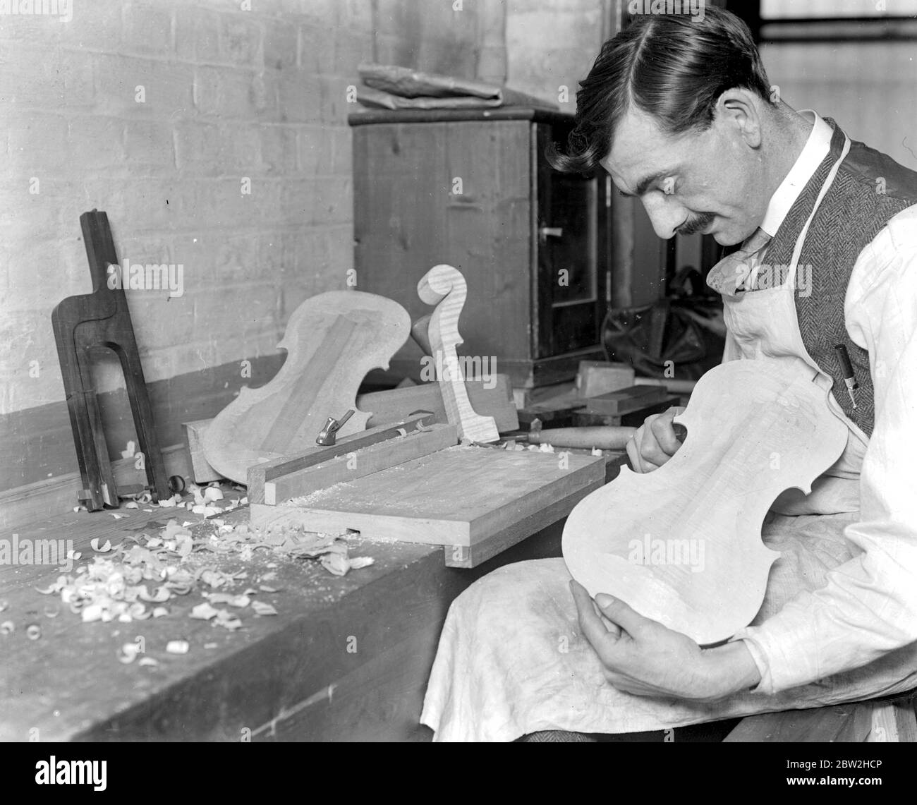 Training Ex Service Men at the music trades Factory . Making a Violin . 22 May 1920 Stock Photo