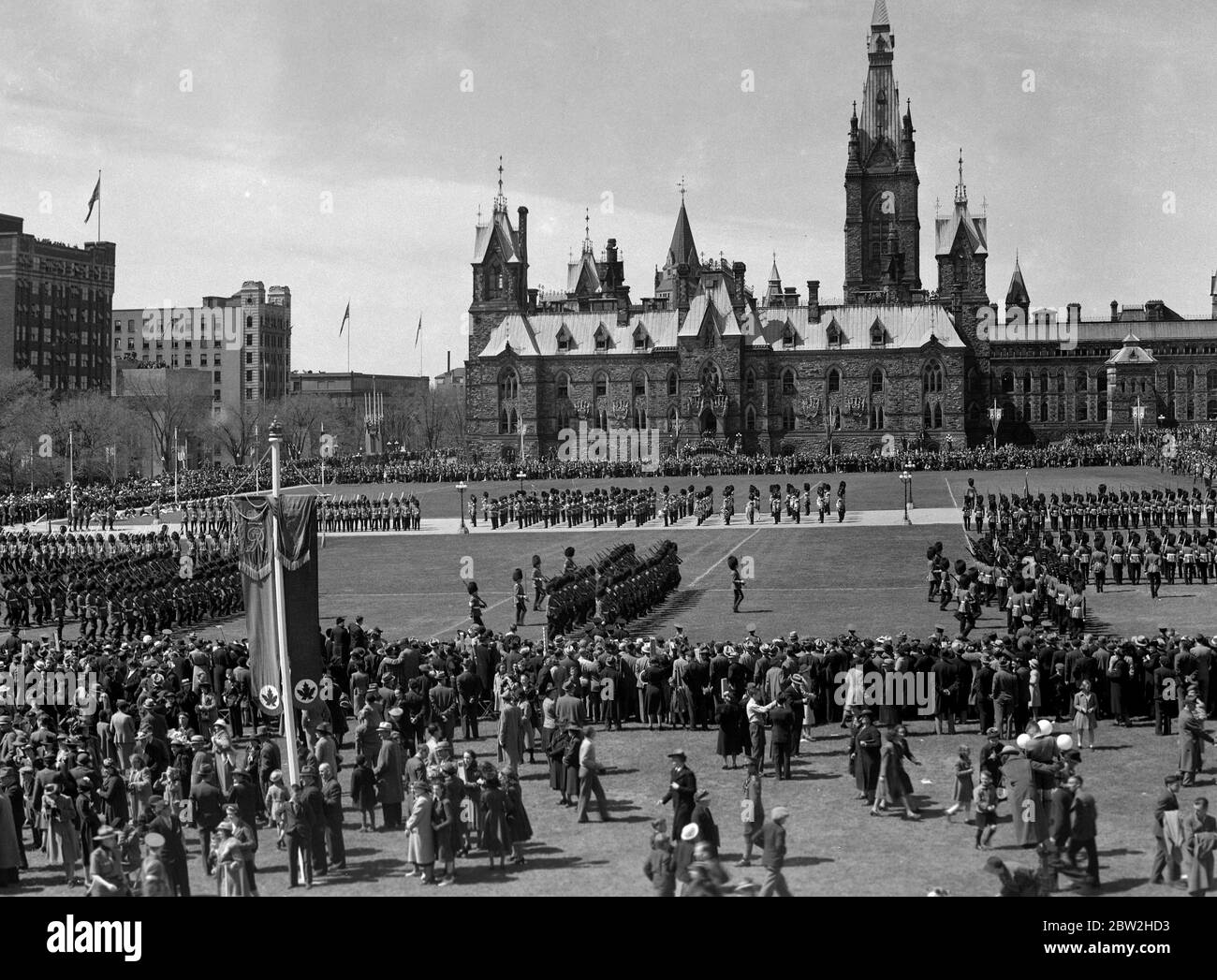 The Royal tour of Canada and the USA by King George VI and Queen Elizabeth , 1939 On Saturday , 20th May , the King 's official birthday was celebrated by the Trooping of the Colour by the brigade of Canadian Guards . There could have been no better setting for the ceremony than that provided by Parliament Square , Ottawa with the Parliament buildings in the background Stock Photo