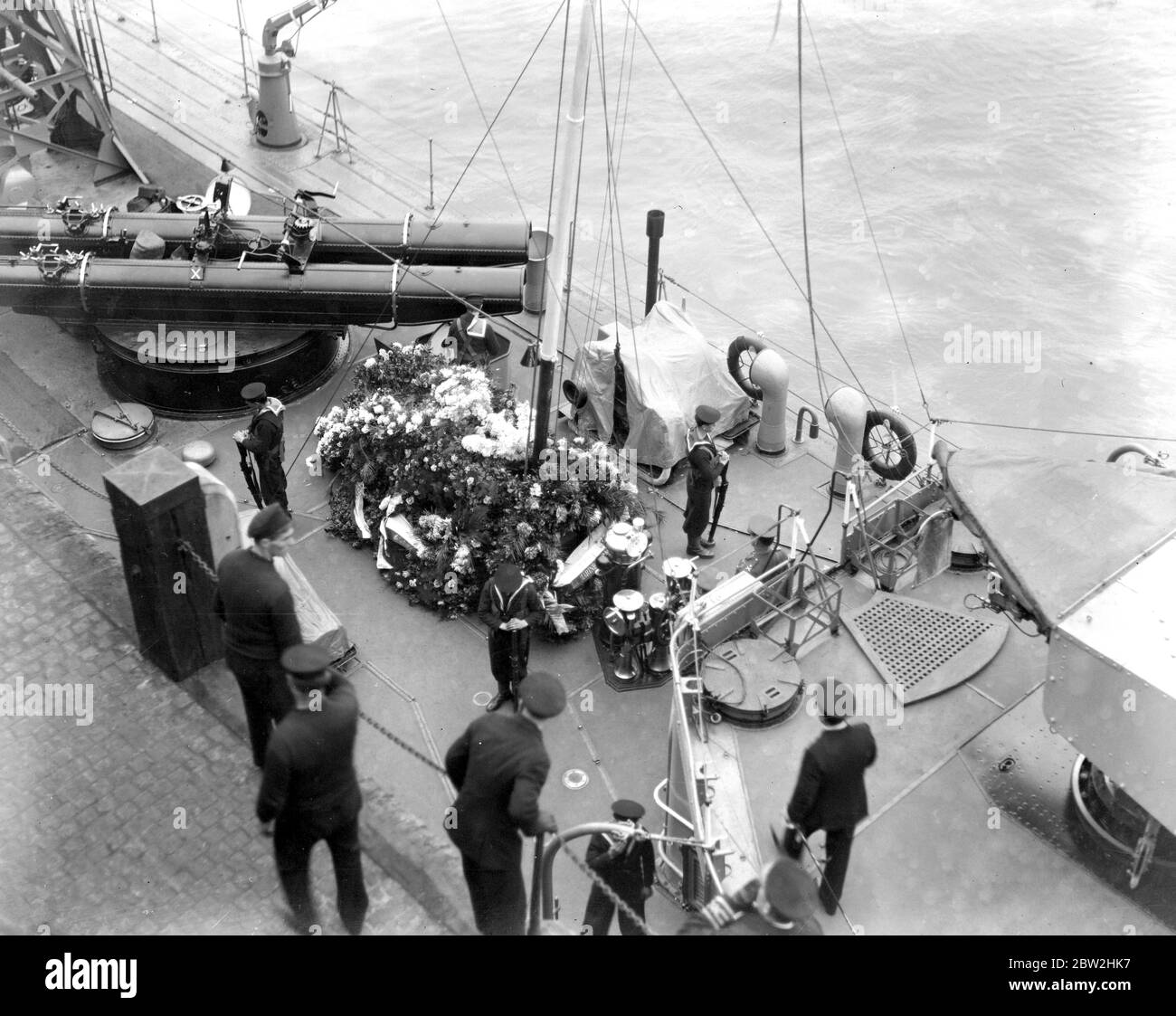 Home coming of Unknown Soldiers on H.M.S. Verdun on way home to England. Photo shows, home coming of Unknown Soldiers on H.M.S. Verdun on way home to England with the flowers covering her fore deck. 11 November 1920 Stock Photo