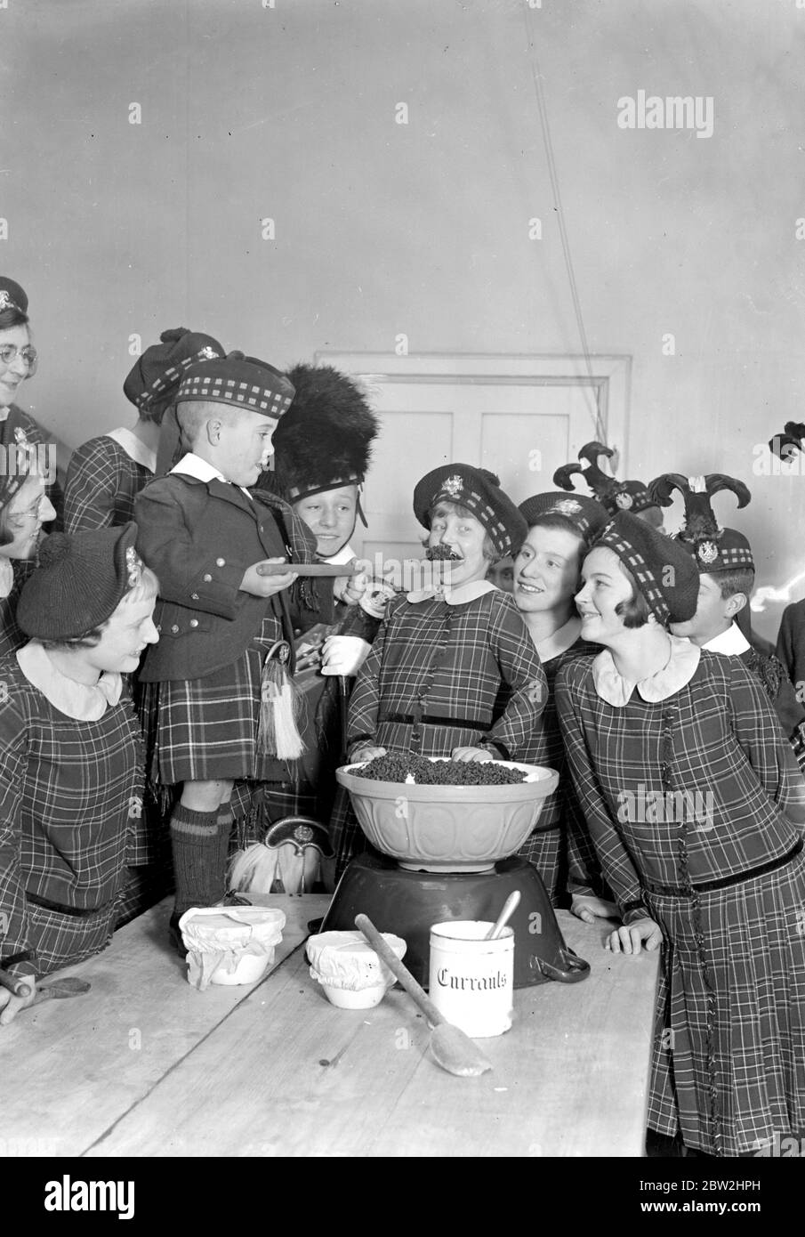 Christmas prepartations at the Royal Caledonian Schools, Bushey. Tasting pudding. 15 November 1933 Stock Photo