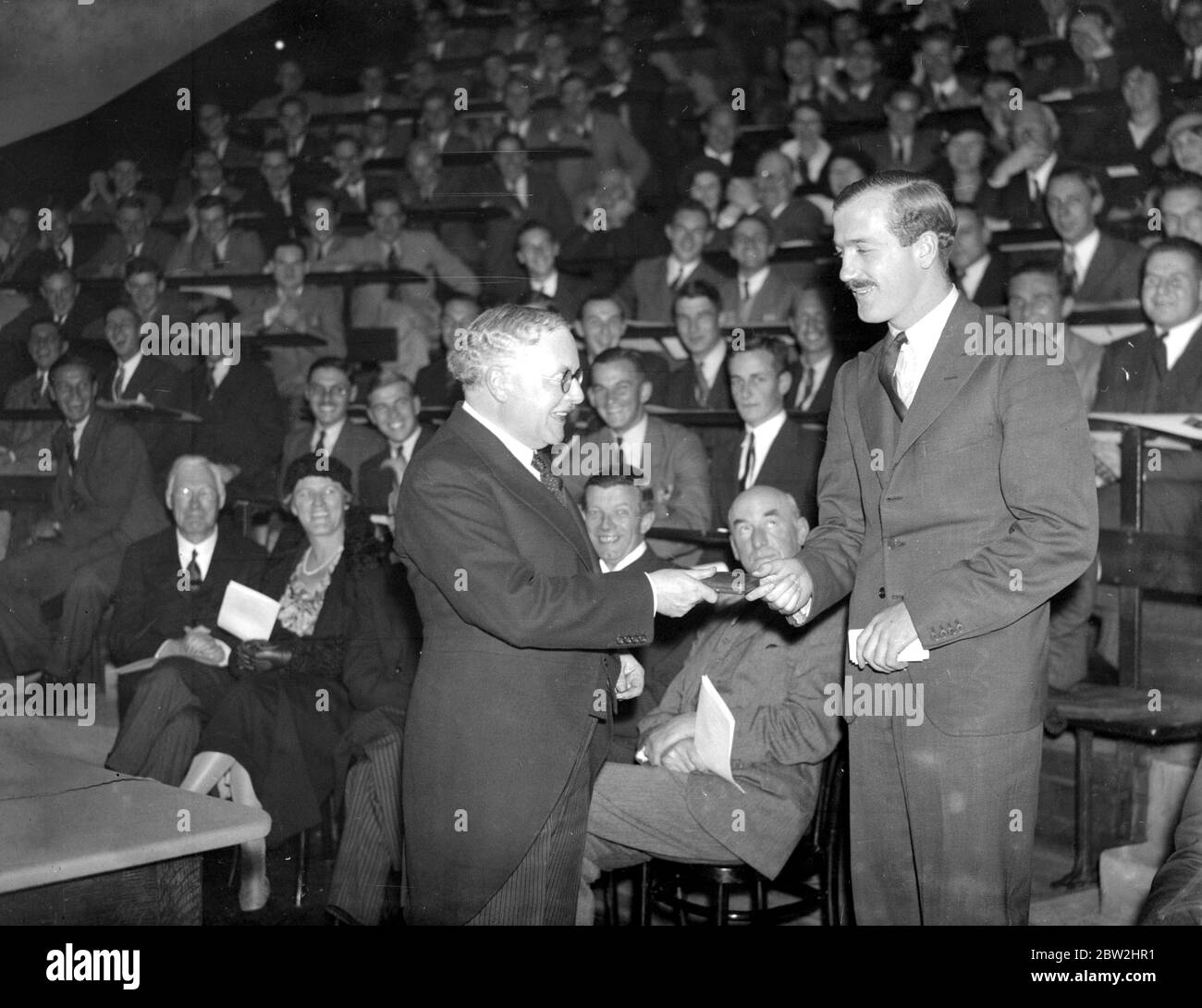 Guy's Hospital Prize distribution by the Minister of Health (Sir Kingsley Wood). Sir Kingsley Wood presenting the treasurer's prize and award to P.W. Clarkson for clinical surgery. 8 October 1935 Stock Photo