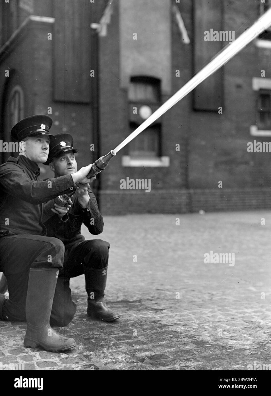 Auxillary Fire Services Demonstration. Southwark Headquarters. Hose practice. 1938 Stock Photo