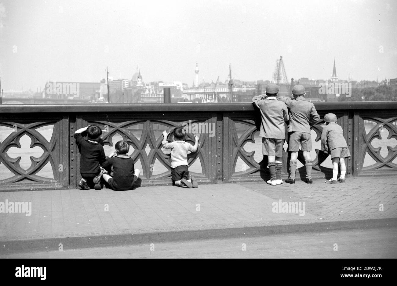 Children viewing the Thames from Tower Bridge. 1933 Stock Photo
