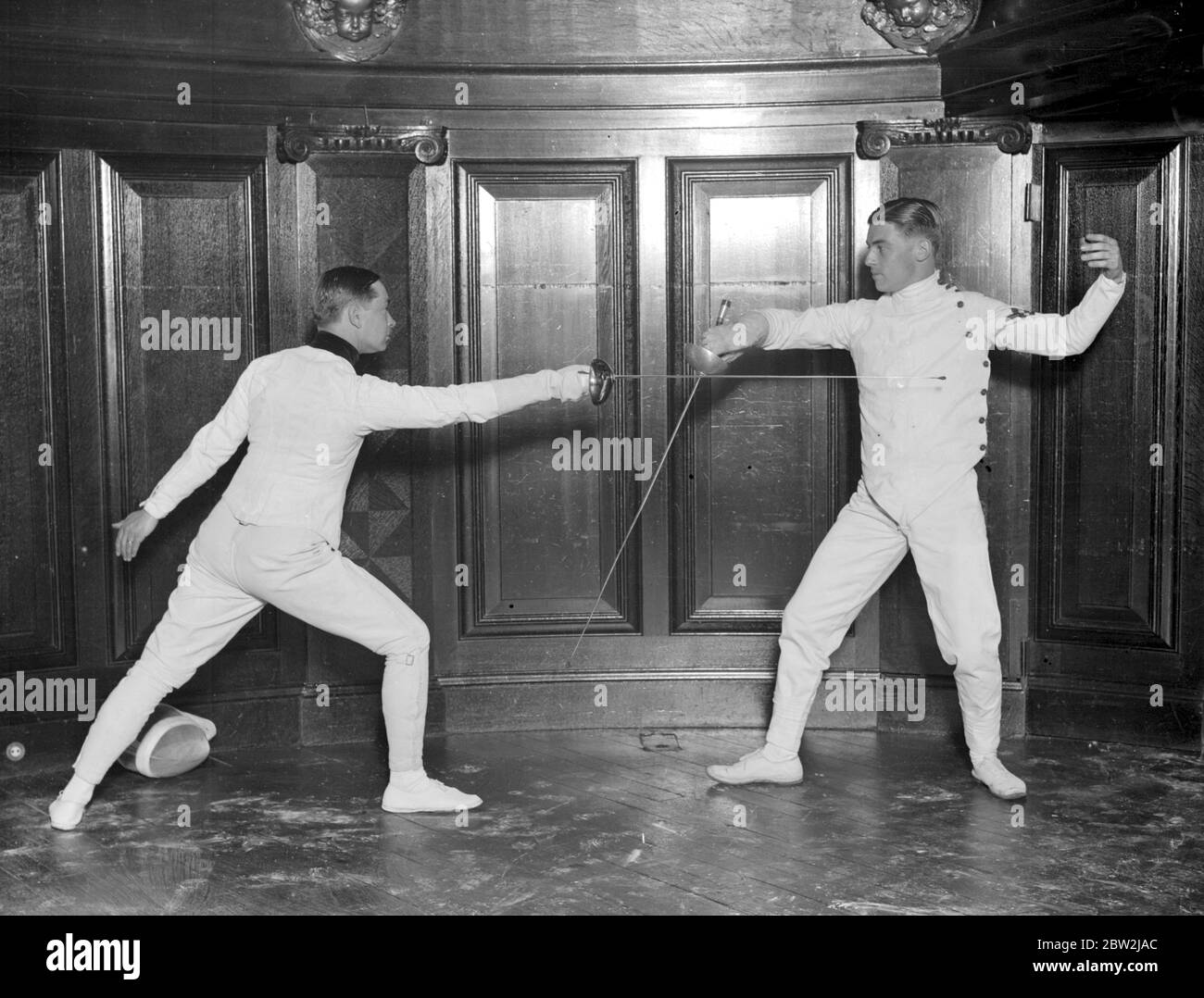 Fencing display at the Aeolian Hall arranged by Professor Felix Grave. Professor E. Froeschlen and R.C. Lewis Stroud. undated Stock Photo