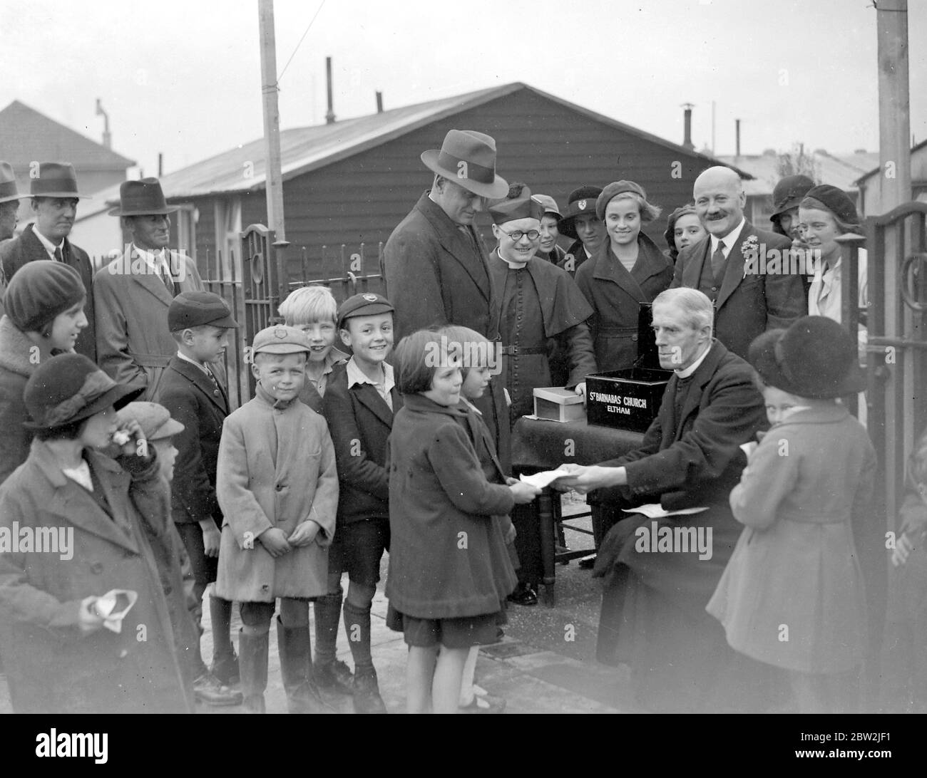 Begging vicars at St Barnabas Church in Eltham, Kent. 1934 Stock Photo
