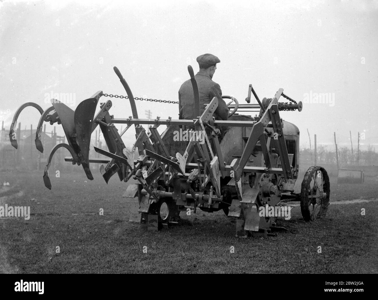 Miller Wheels Utility. A rear lifting plough and ride. 1934 Stock Photo