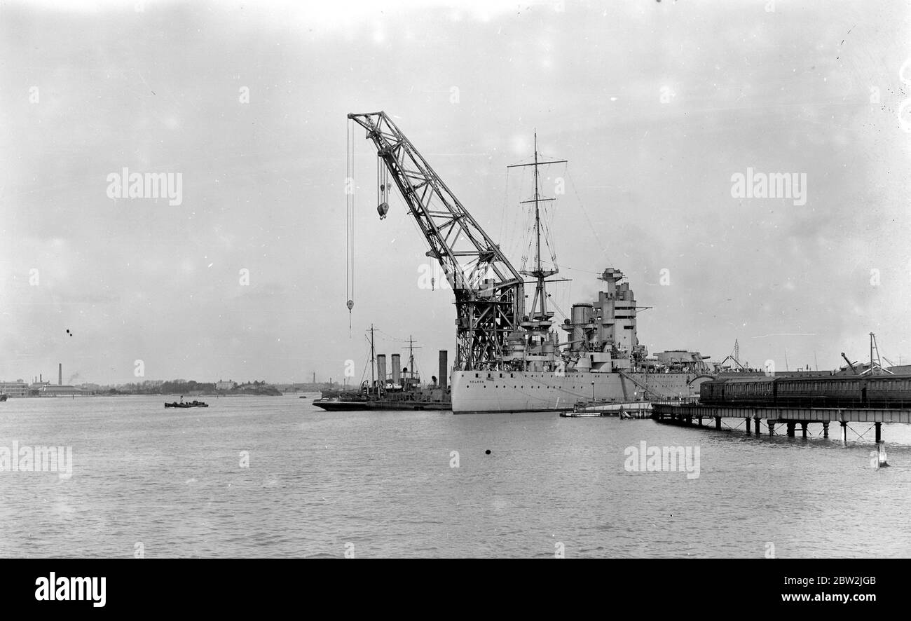 H.M.S. Nelson in dock at Portsmouth beside her is a giant admiralty crane. 28 April 1927 Stock Photo