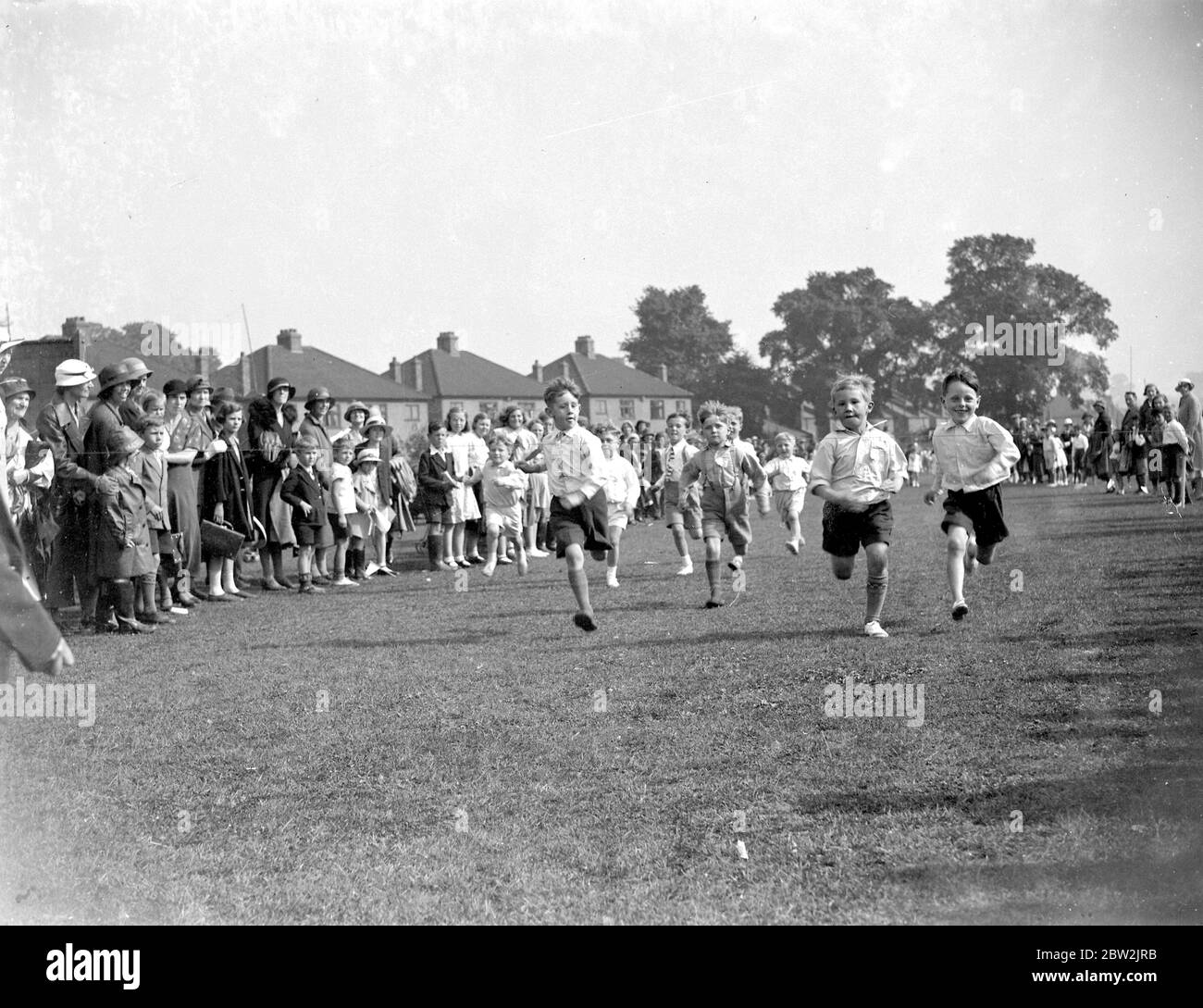 Little boys taking part in a sports day race. 1934 Stock Photo