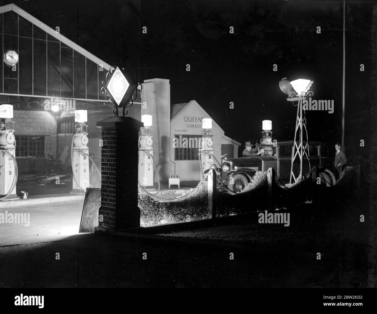 Queen's Garage seen at night. 1934 Stock Photo