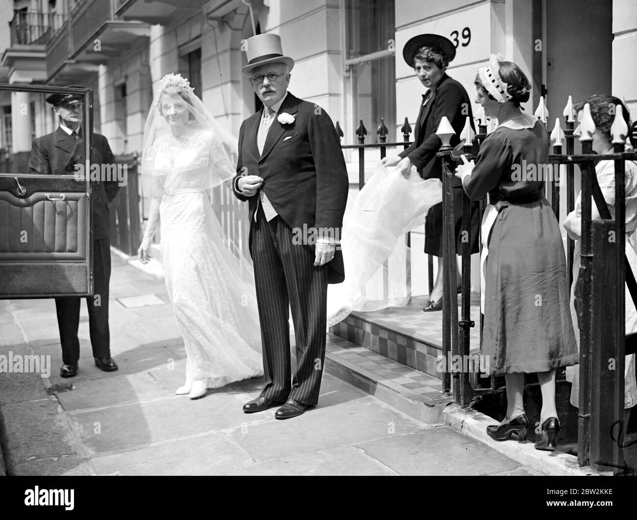 Miss Anne Chilton and her father Sir Henry Chilton, leaving for her wedding to Mr Thomas Dupree ay Holy Trinity, Brompton. 11 July 1938 Stock Photo