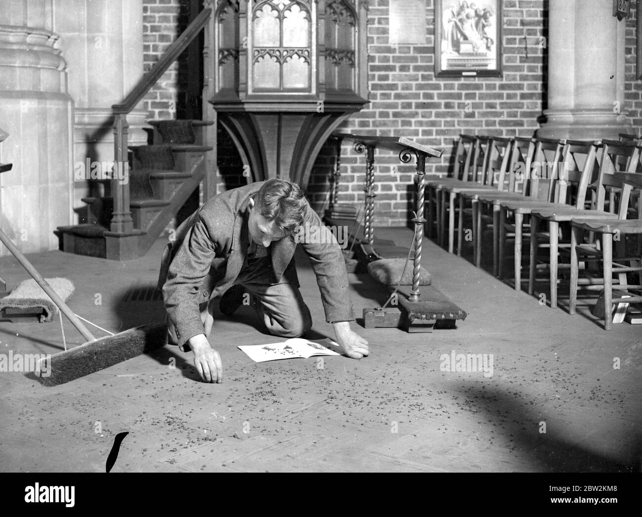 Sweeping and counting flies in a church in Swanley, Kent. 1934 Stock