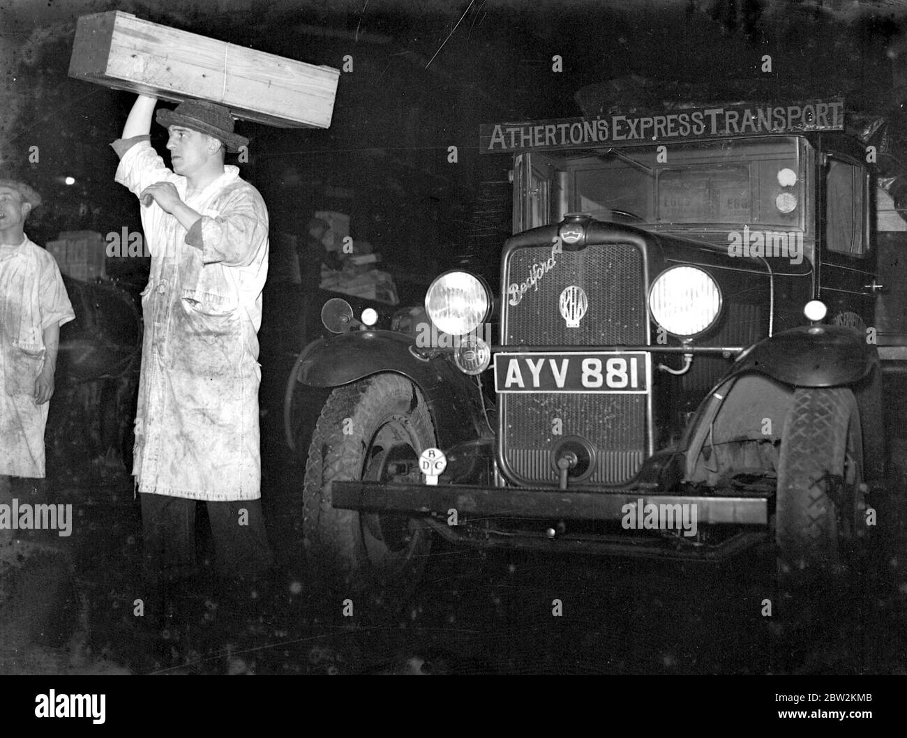 Bedford truck of the Athertons Express Transport. Night Scene at Billingsgate Market, London. loaded. 1934 Stock Photo