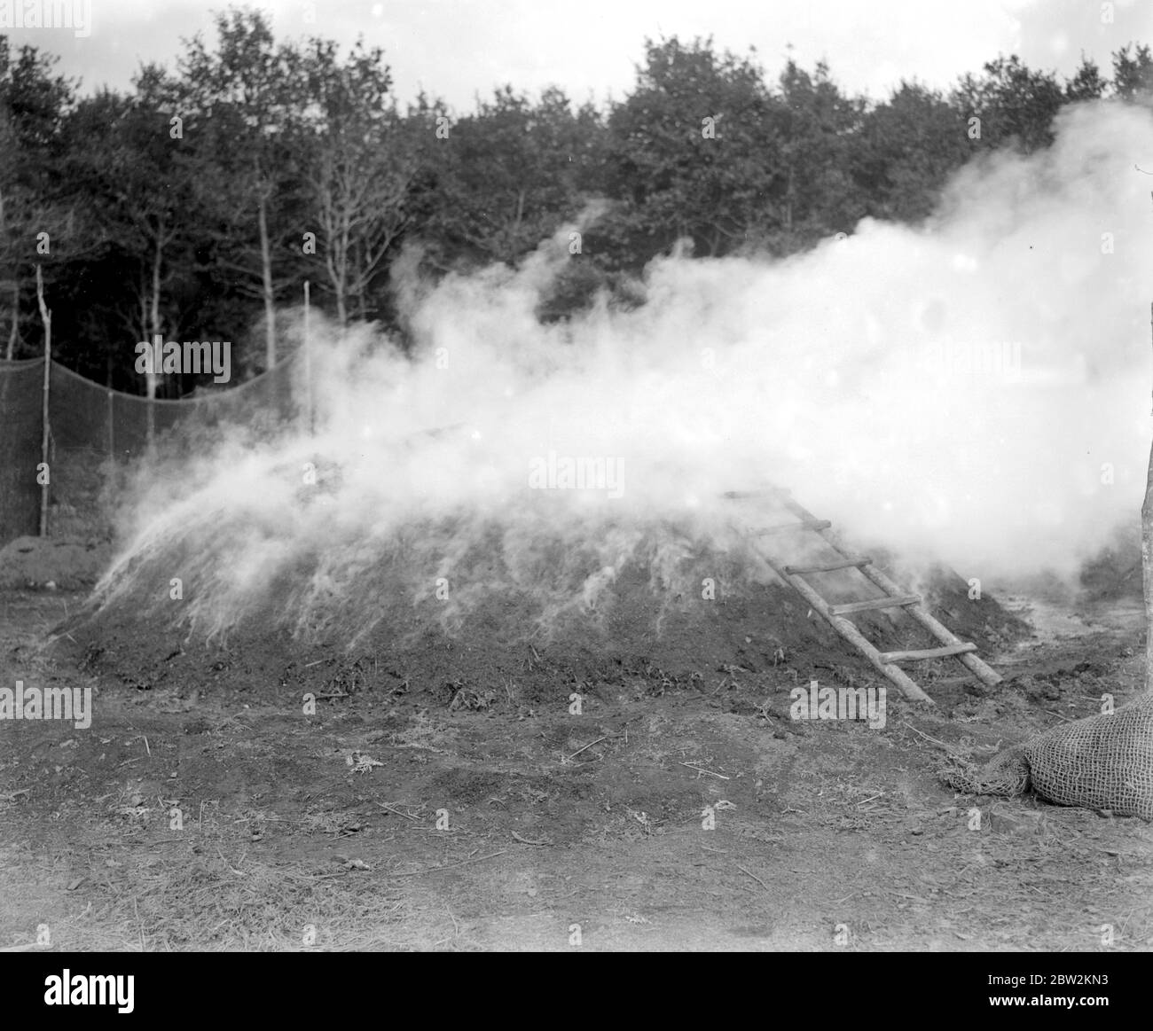 Charcoal burning for the trenches in the New Forest. Char-ring. Stock Photo