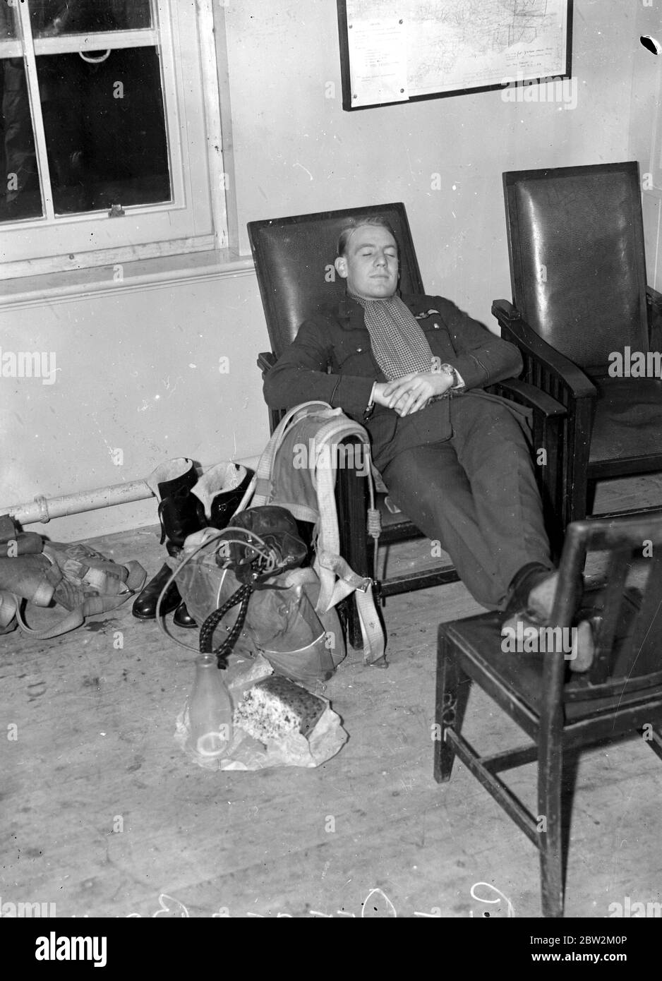 Home defence Service at Biggin Hill, a pilot from No. 32 Squadron RAF who fly Hurricane fighters, rests while on standby in the ready room. 9 August 1939 Stock Photo