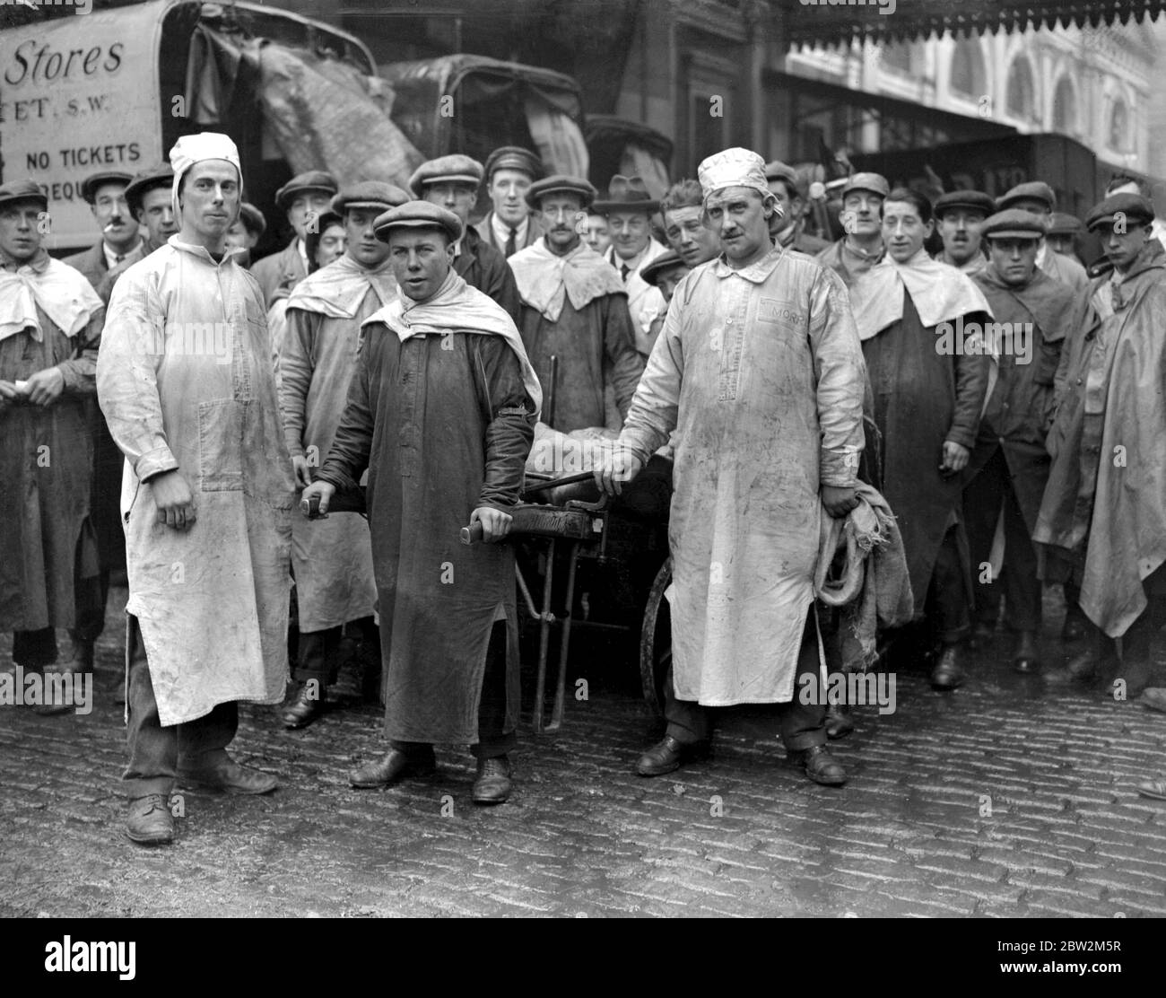 Smithfield Market meat porters in new headgear and smocks , approved by Minister of Health . 1 April 1925 Stock Photo
