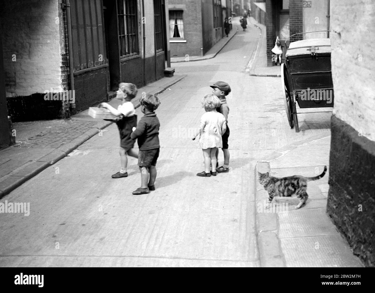 Small children in a street. 1933 Stock Photo