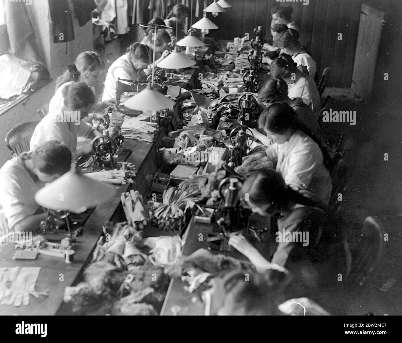 Glove Making At Witney . Machine Department sewing , buttoning and