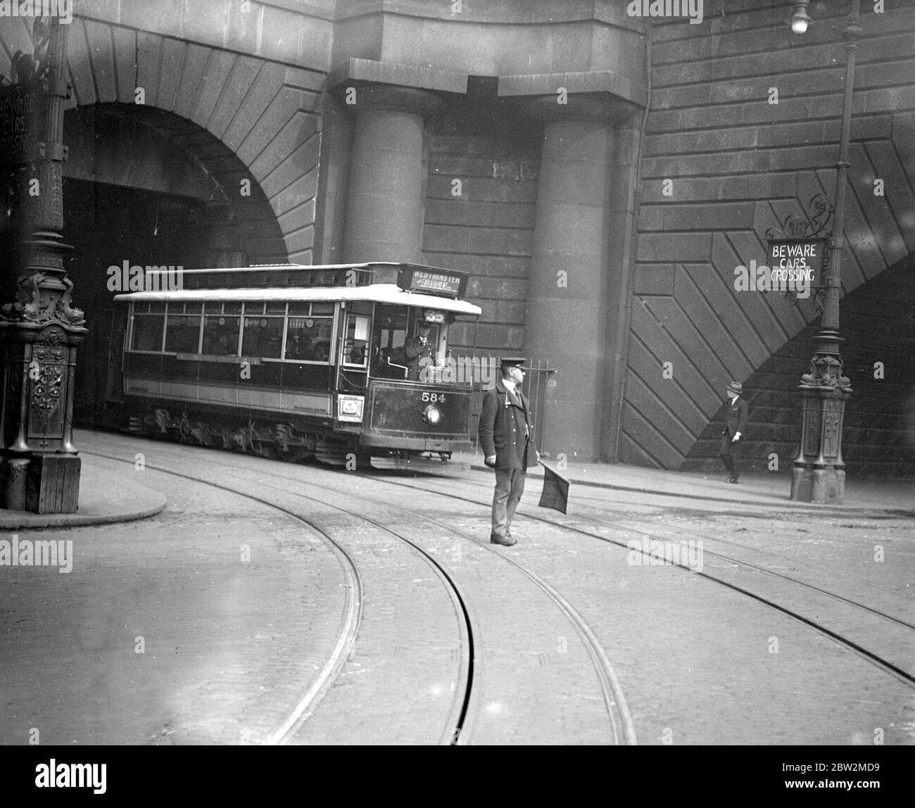 Taken for Mr Tupholme - A tram emerges on the Embankment. 1930's Stock Photo