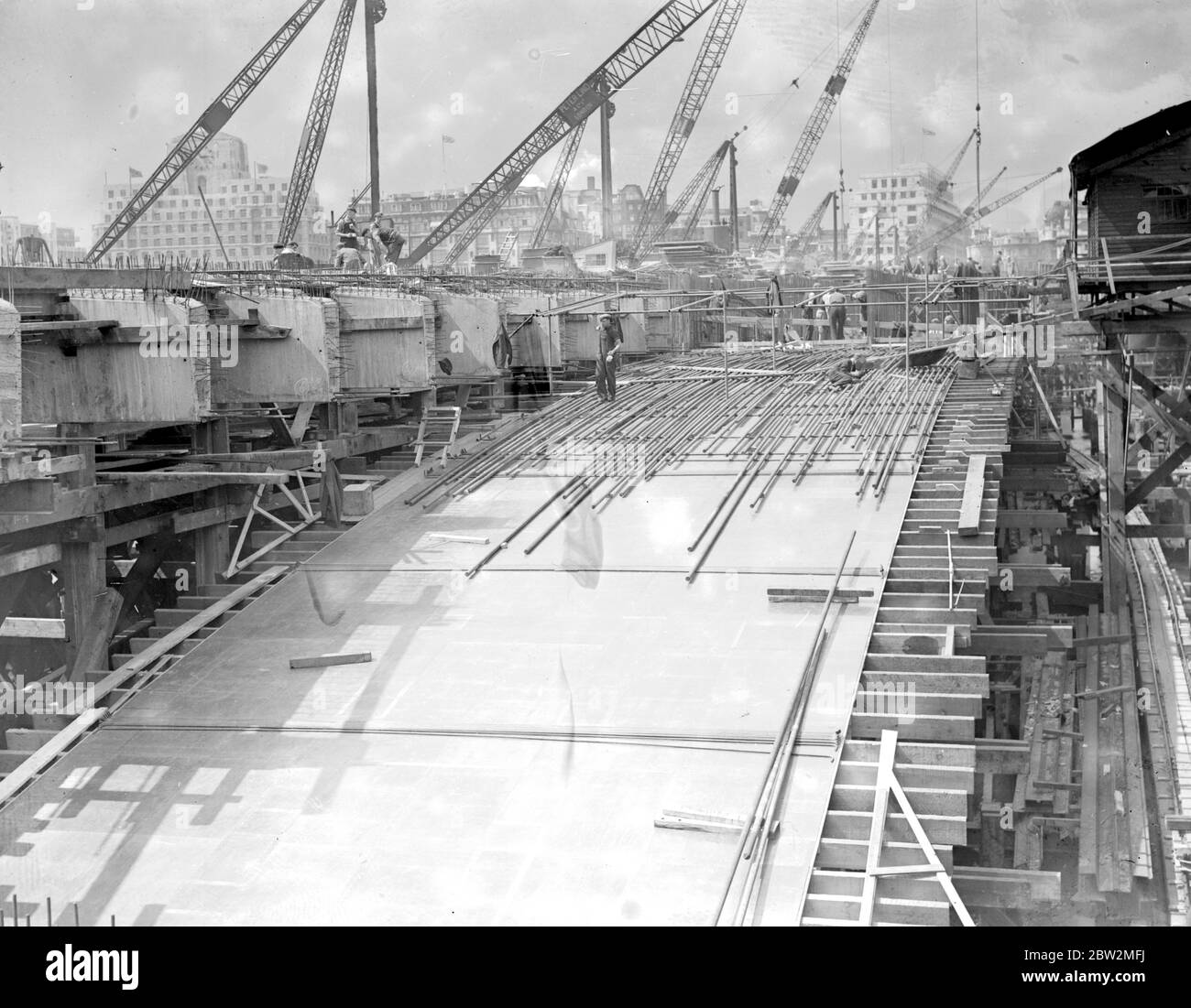 The new Waterloo Bridge under construction. covering a span with polished three ply wood. The surface equalling a first class dance floor. 17 July 1939. Stock Photo