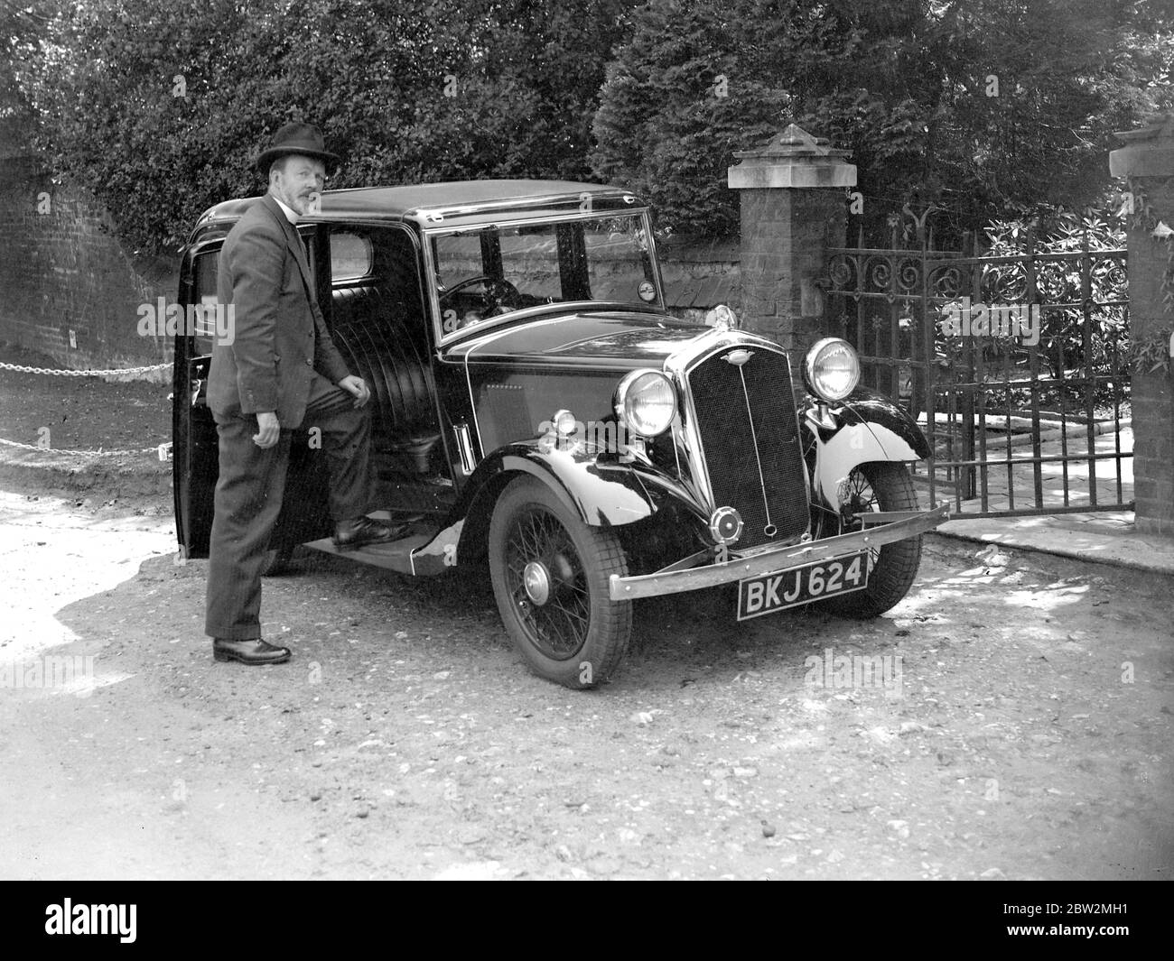 Reverand Handiman and hi car. 1934 Stock Photo