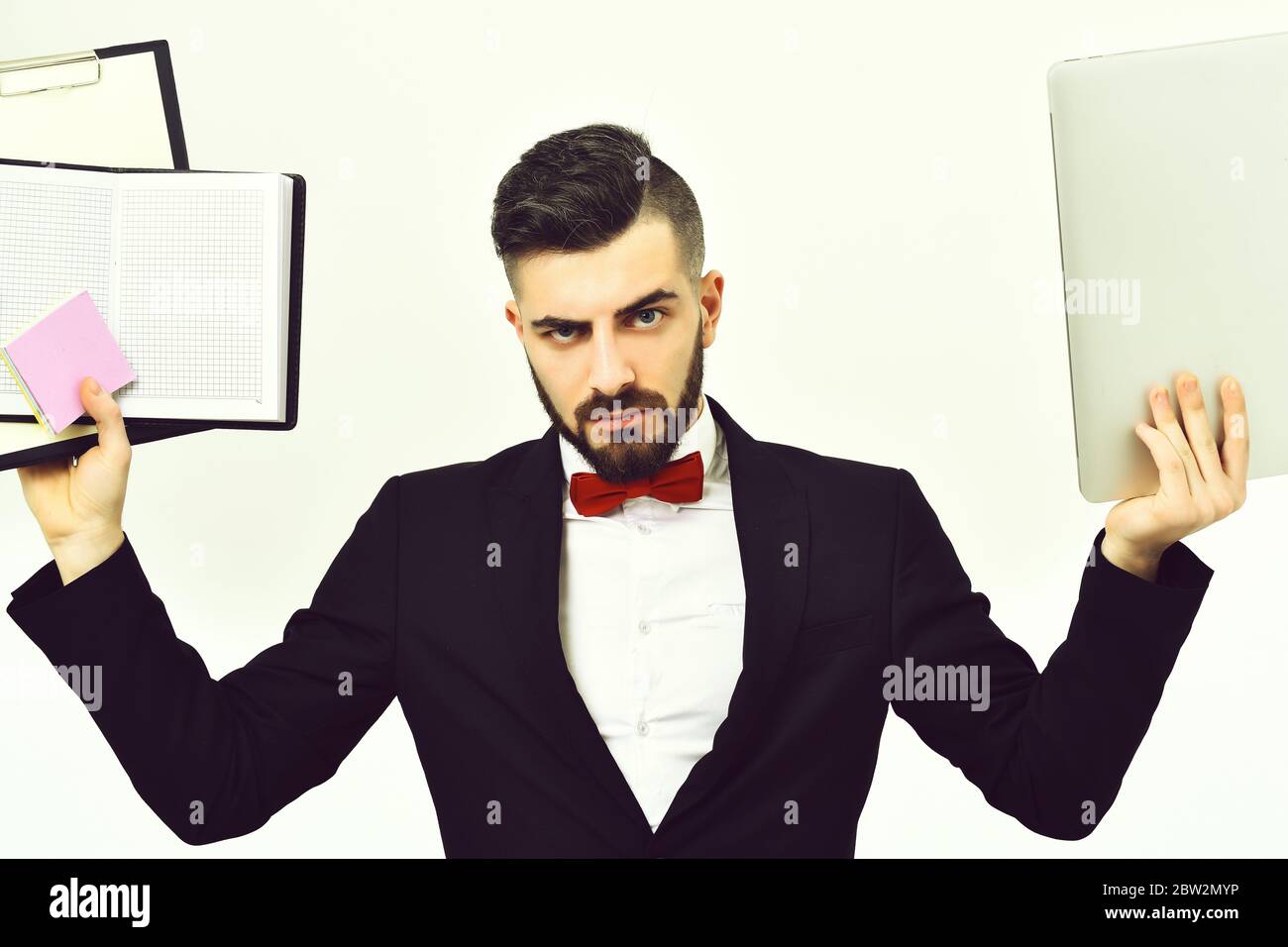 Project manager having strict and angry look holds clip folder with ...