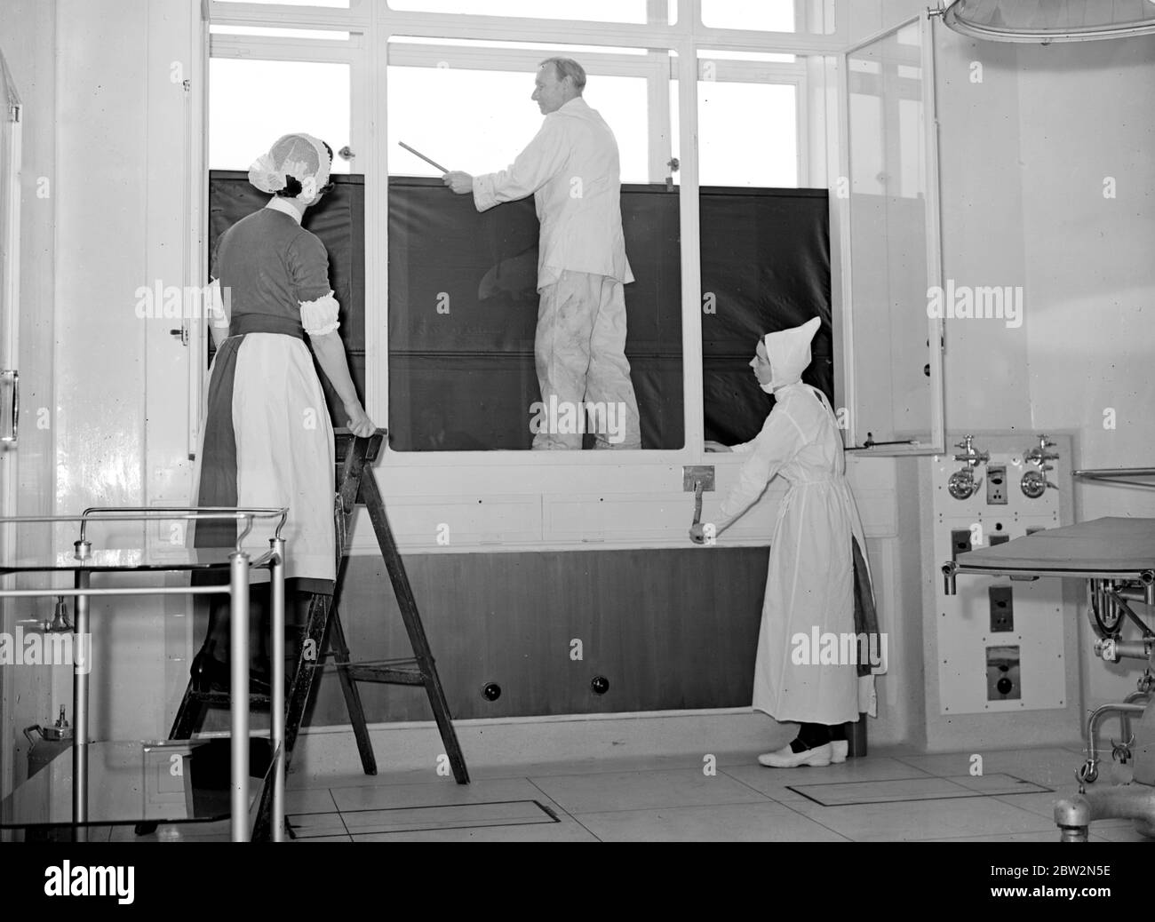 The Crisis, 1939. A.R.P. Precautions - darkening windows at Westminster Hospital.. 8 August 1939 Stock Photo
