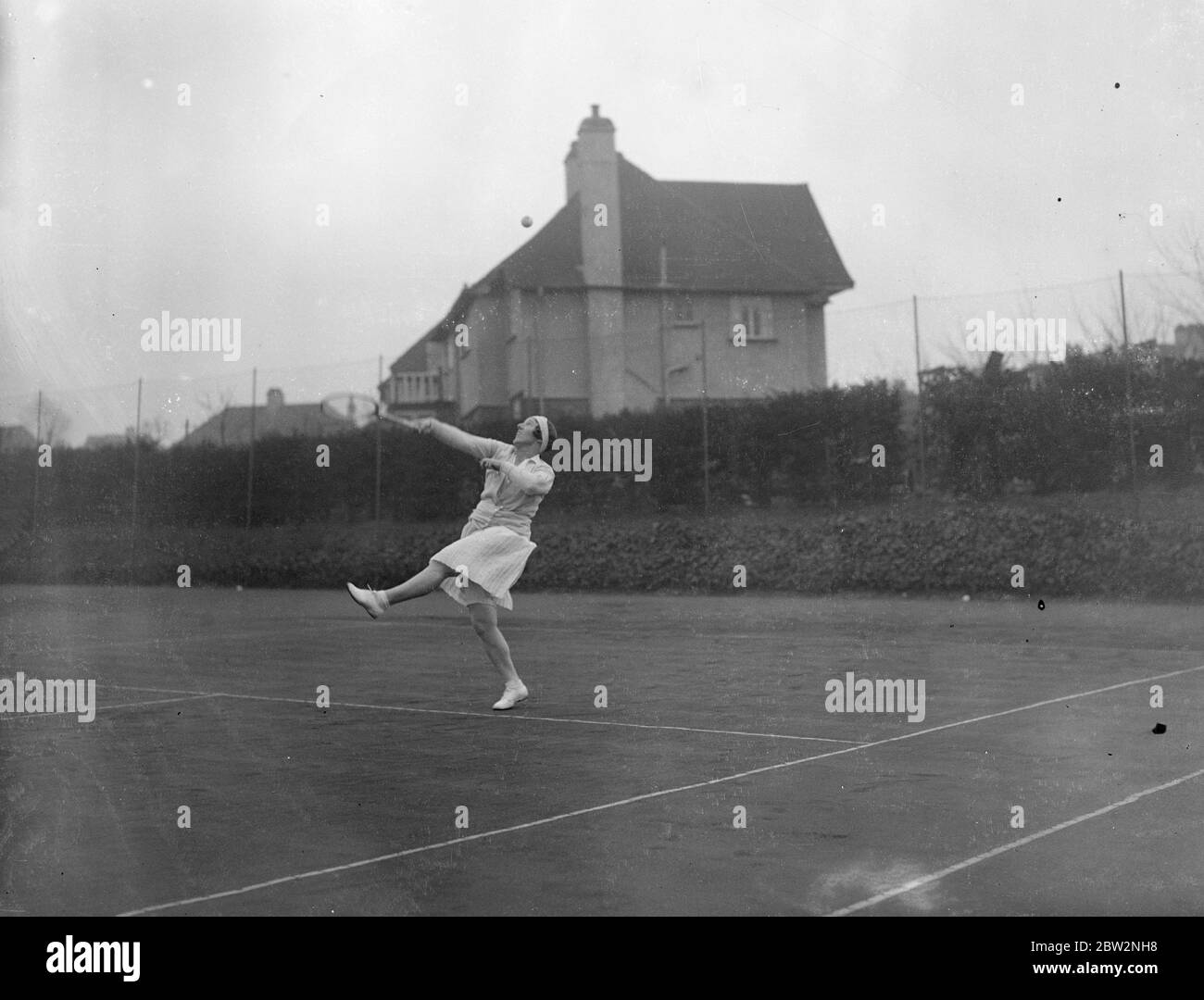 First tennis tournament of the year opens at Sutton . The first lawn tennis tournament of the year , between Surrey and Essex ladies , opened at the Sutton Hard Courts Club , Sutton , Surrey . Miss Phyllis Mudford in play during the opening rounds of the tournament . 26 February 1932 30s, 30's, 1930s, 1930's, thirties, nineteen thirties Stock Photo