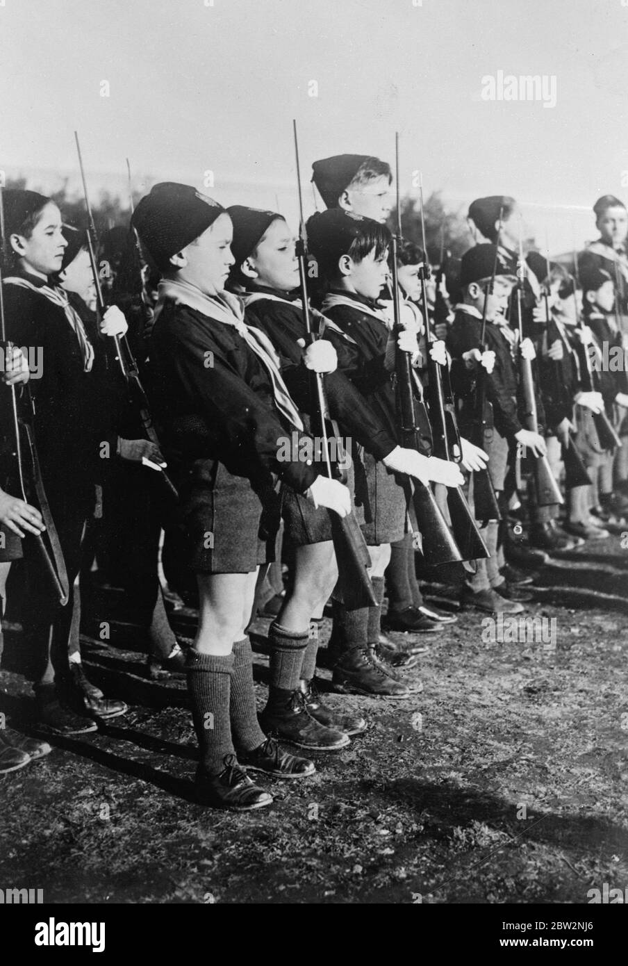 Mussolini ' s boy soldiers on parade . Mussolini ' s boy soldiers on parade at a great review of the young fascists near Madrid . 25 February 1932 30s, 30's, 1930s, 1930's, thirties, nineteen thirties Stock Photo