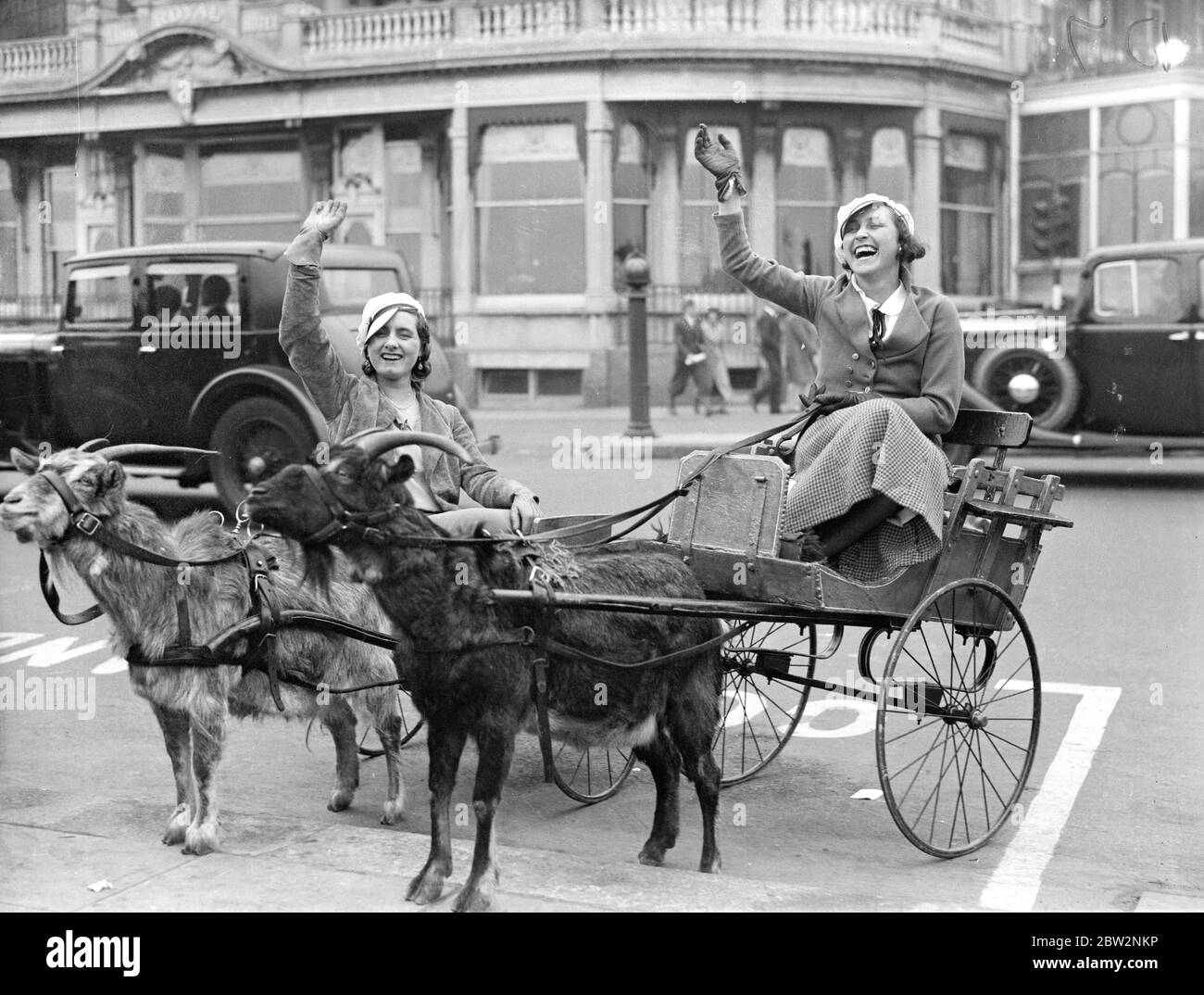 Off for a trot at Brighton . Two girl visits to Brighton on Whit Monday , try a novel means of transport . 21 May 1934 . Stock Photo