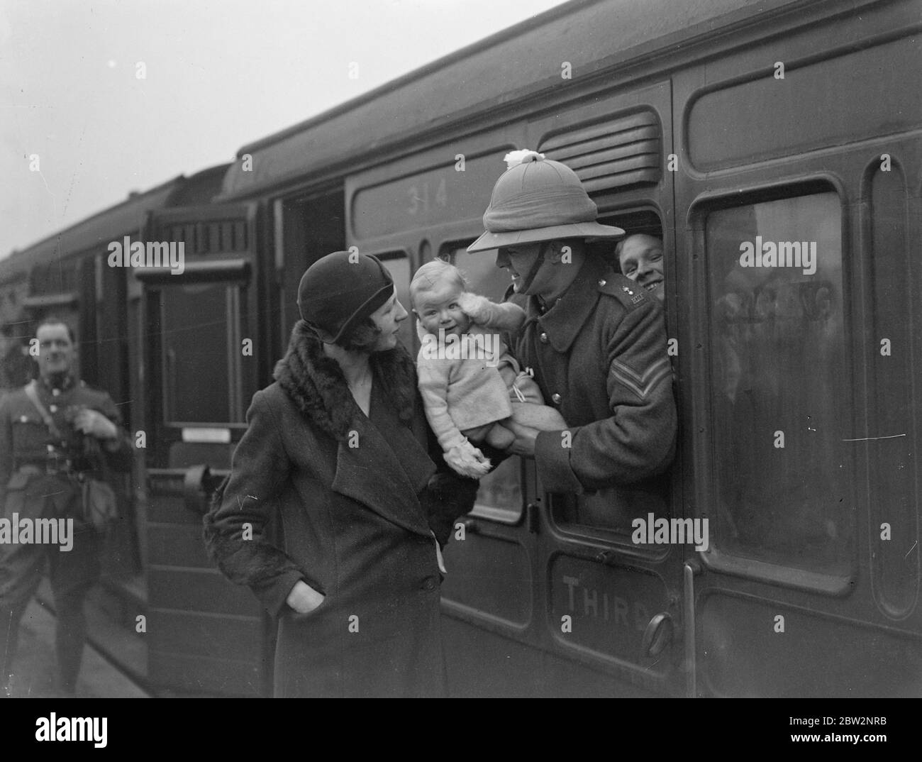 Scots fusiliers ' Prince of Wales regiment leave for Palestine . The 1st Battalion the Royal Scots Fusiliers , of which the Prince of Wales is Colonel , left Bordon Camp near Aldershot , for Palestine . One of the men bidding goodbye to his wife and baby on Bordon Station as the regiment entertained . . 23 February 1932 30s, 30's, 1930s, 1930's, thirties, nineteen thirties Stock Photo