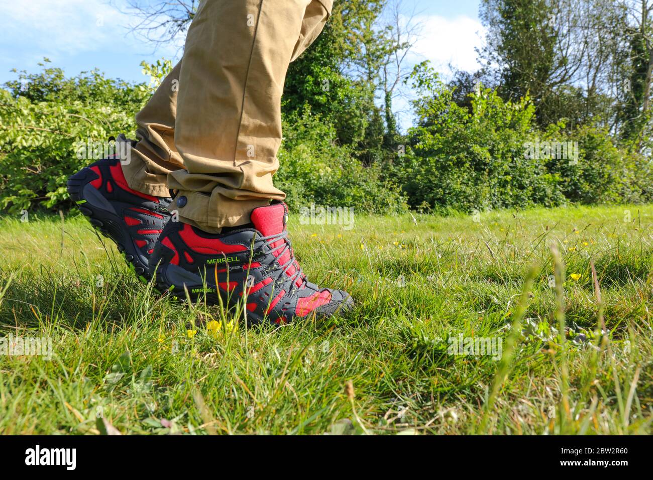 Man legs walking outdoor with a pair of Merrell Red Accentor Sport GORE