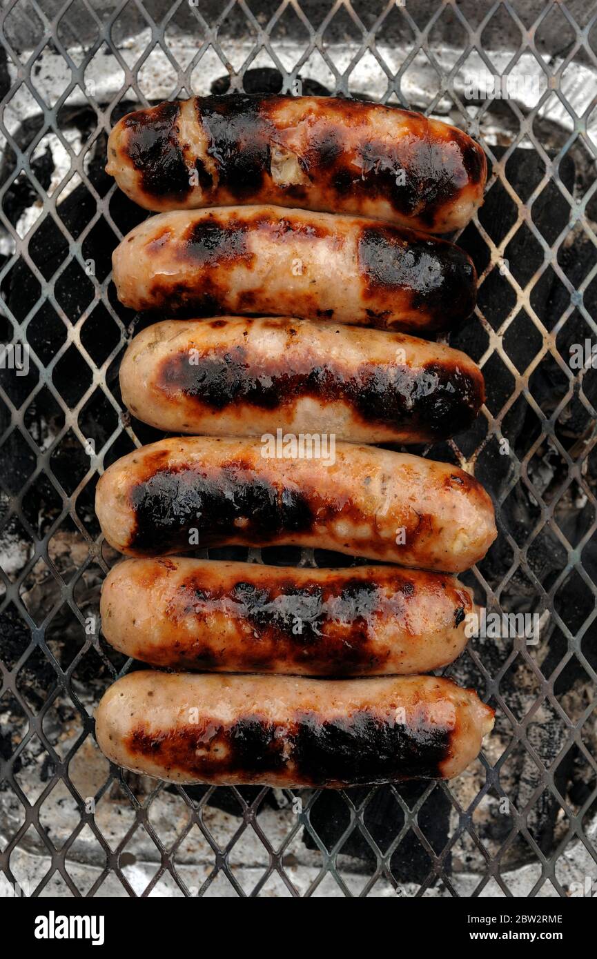 Sausages on a disposable barbecue Stock Photo