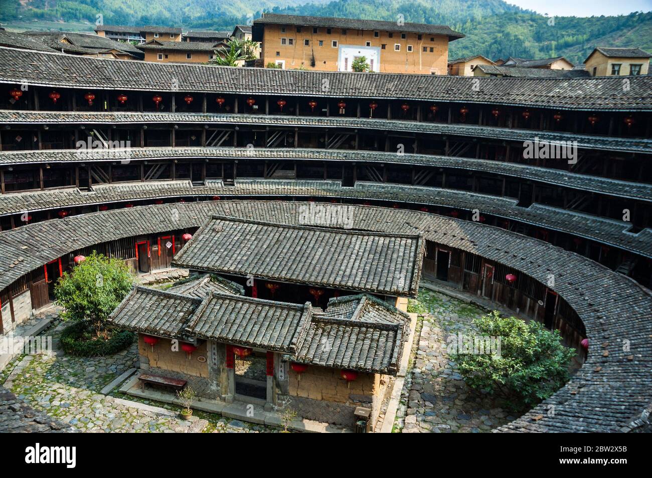 Jiqing lou earth building in the Chuxi Cluster of tulou in Yongding County with an ancestral hall Stock Photo