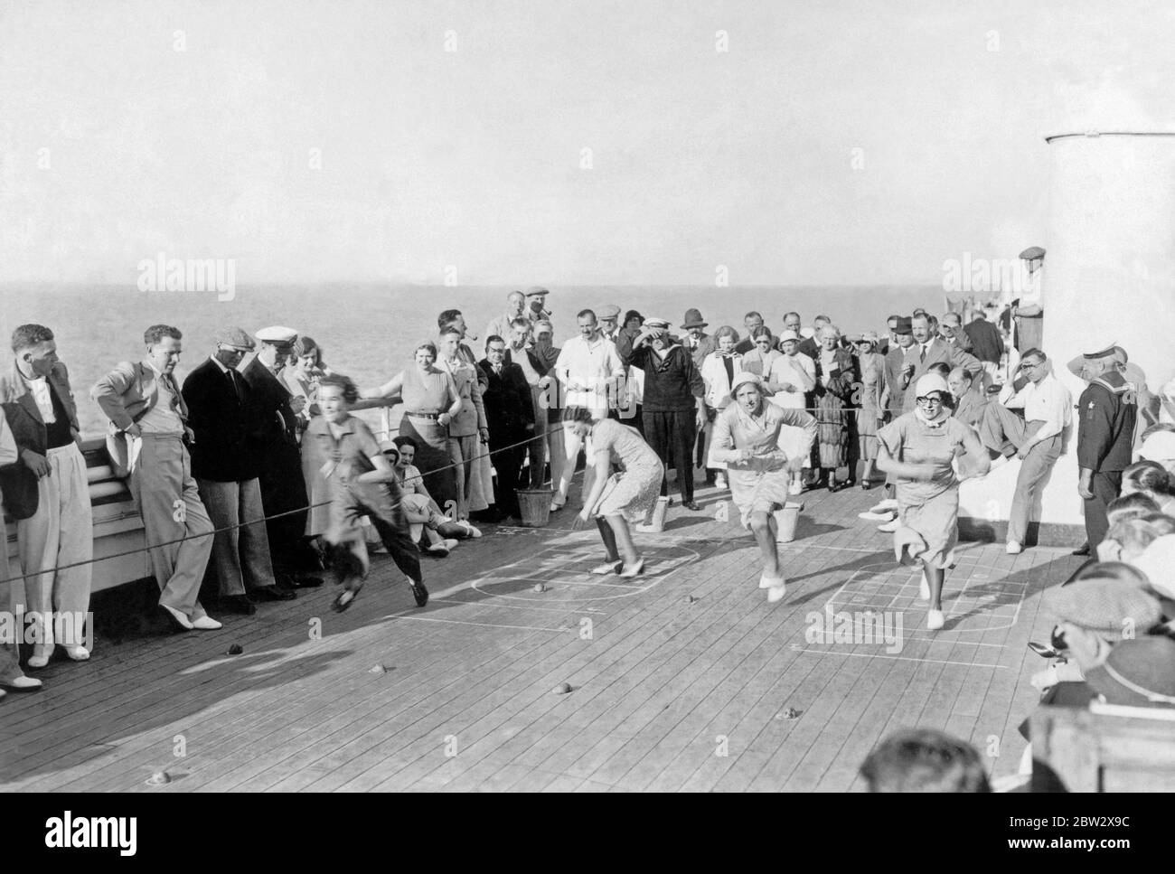 Deck games on board an ocean liner in the 1930s. Here a running contest involving female passengers draws a sizeable audience. Stock Photo
