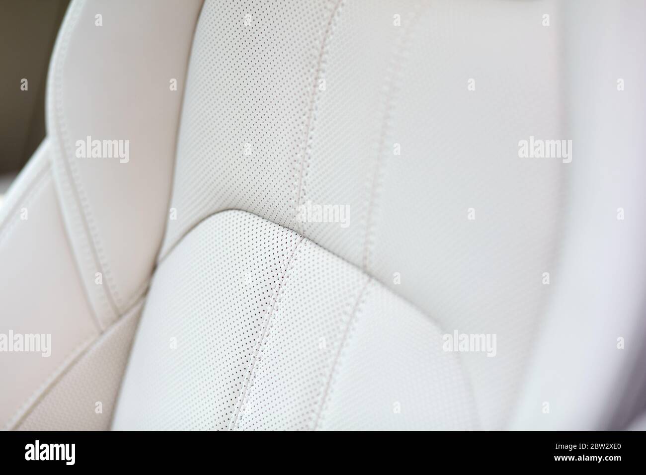 White leather seat of an expensive and luxurious car. Shallow depth of field. Stock Photo