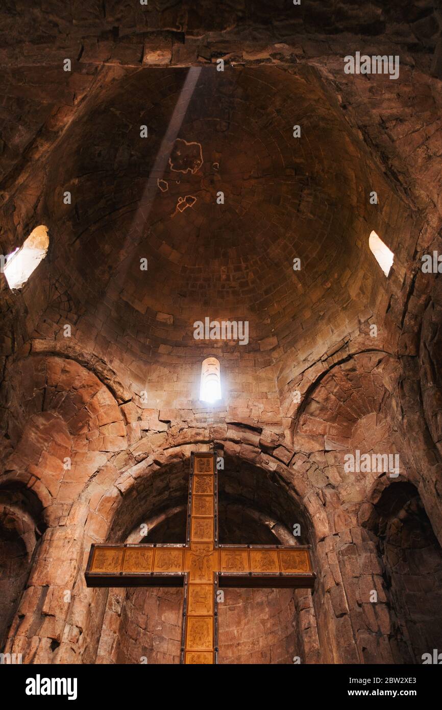 A ray of sunlight beams into the Jvari Monastery of Mtskheta, an historic orthodox monastery on a hilltop dating back to 590 CE, near Tbilisi, Georgia Stock Photo