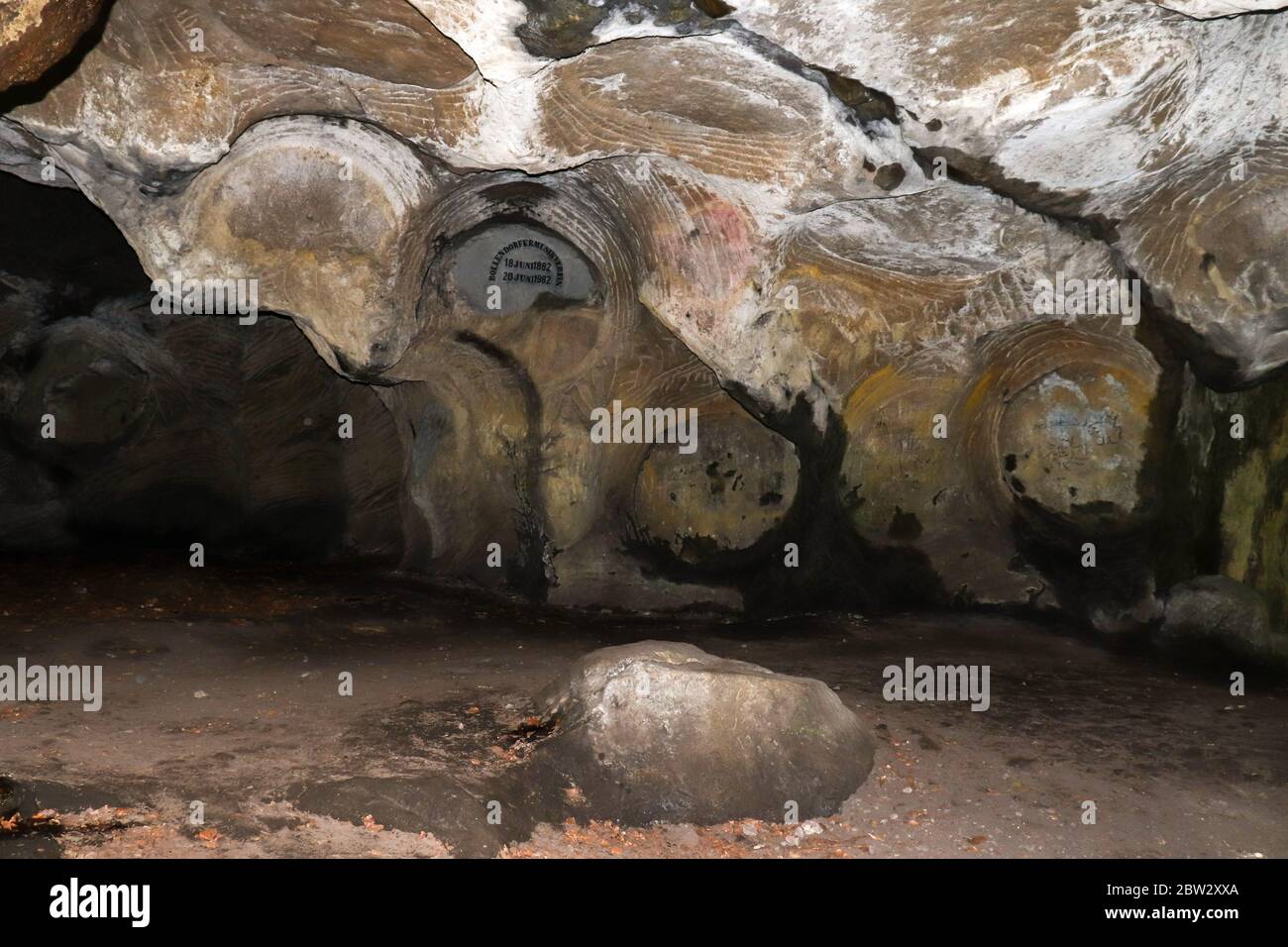 Sign and markings from mining in Hohllay Cave in Luxembourg. Stock Photo