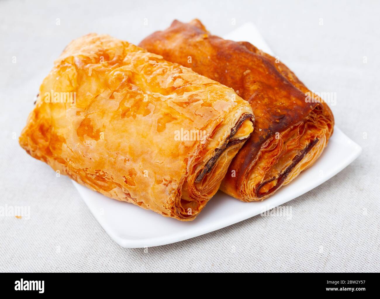 Puff pastry pie with meat and cheese, spanish pastry napolitana Stock