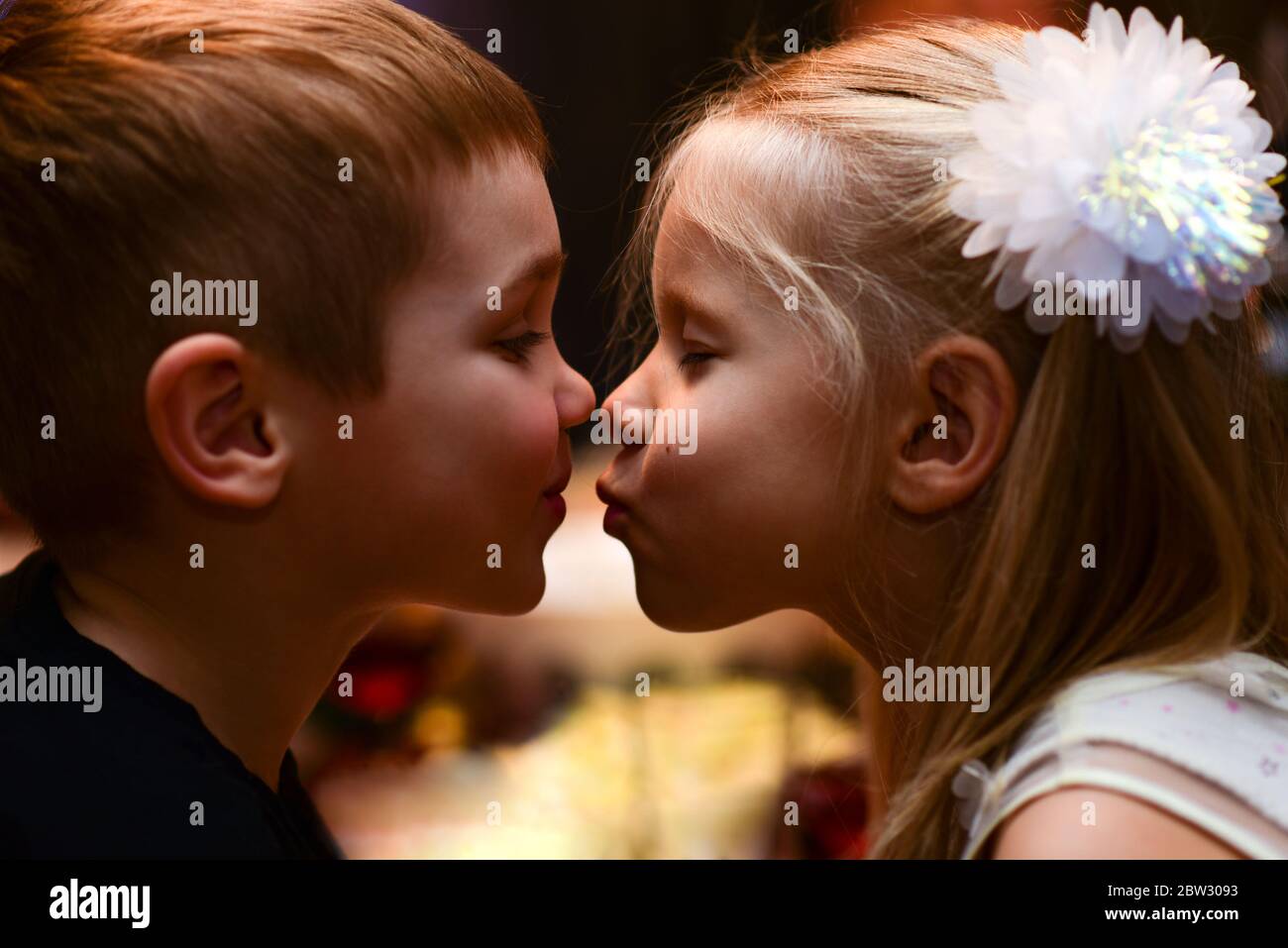 Children boy with girl kiss on holiday Stock Photo Alamy