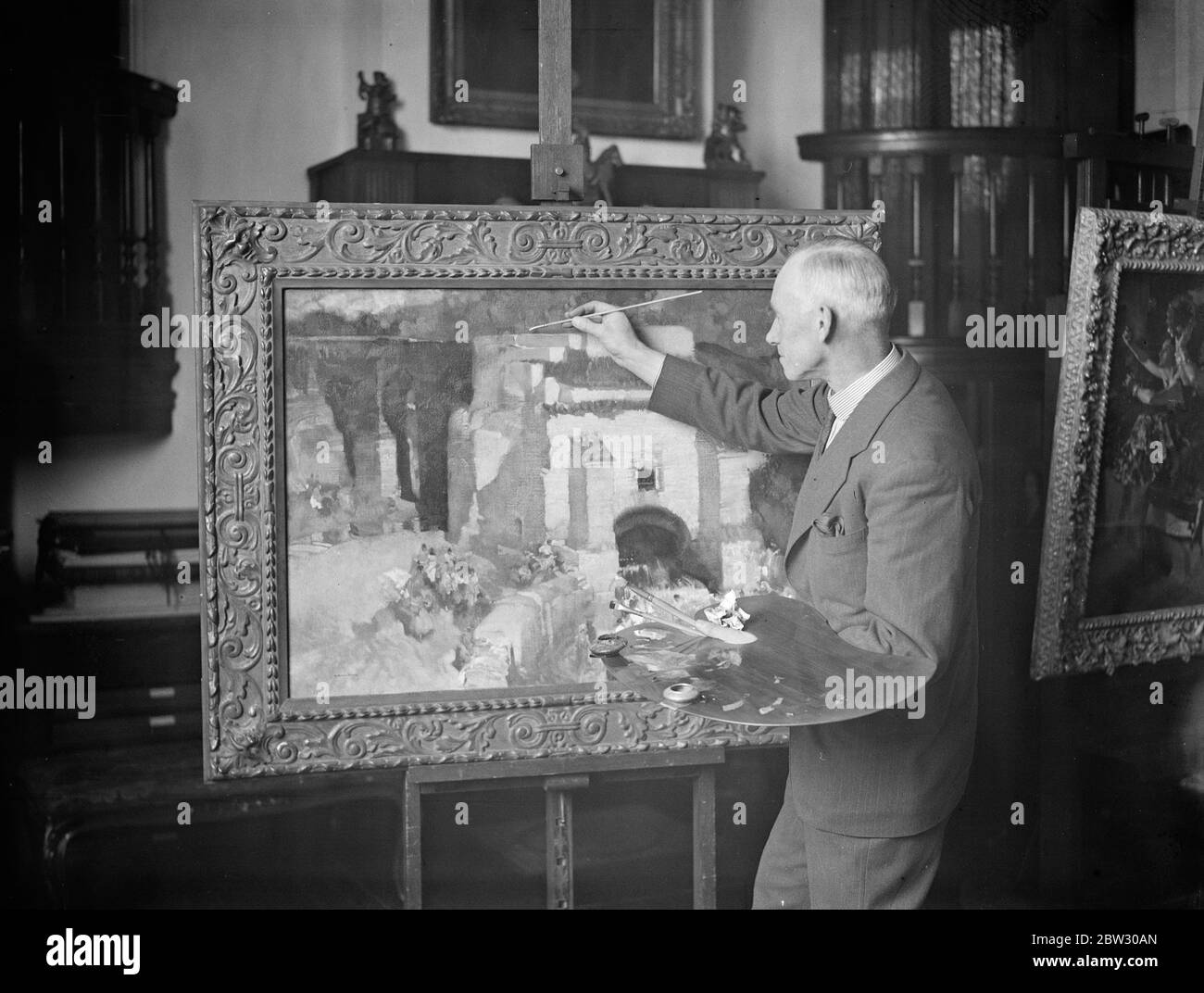Mr W Russell Flint RA at work on a picture . 23 March 1932 Stock Photo