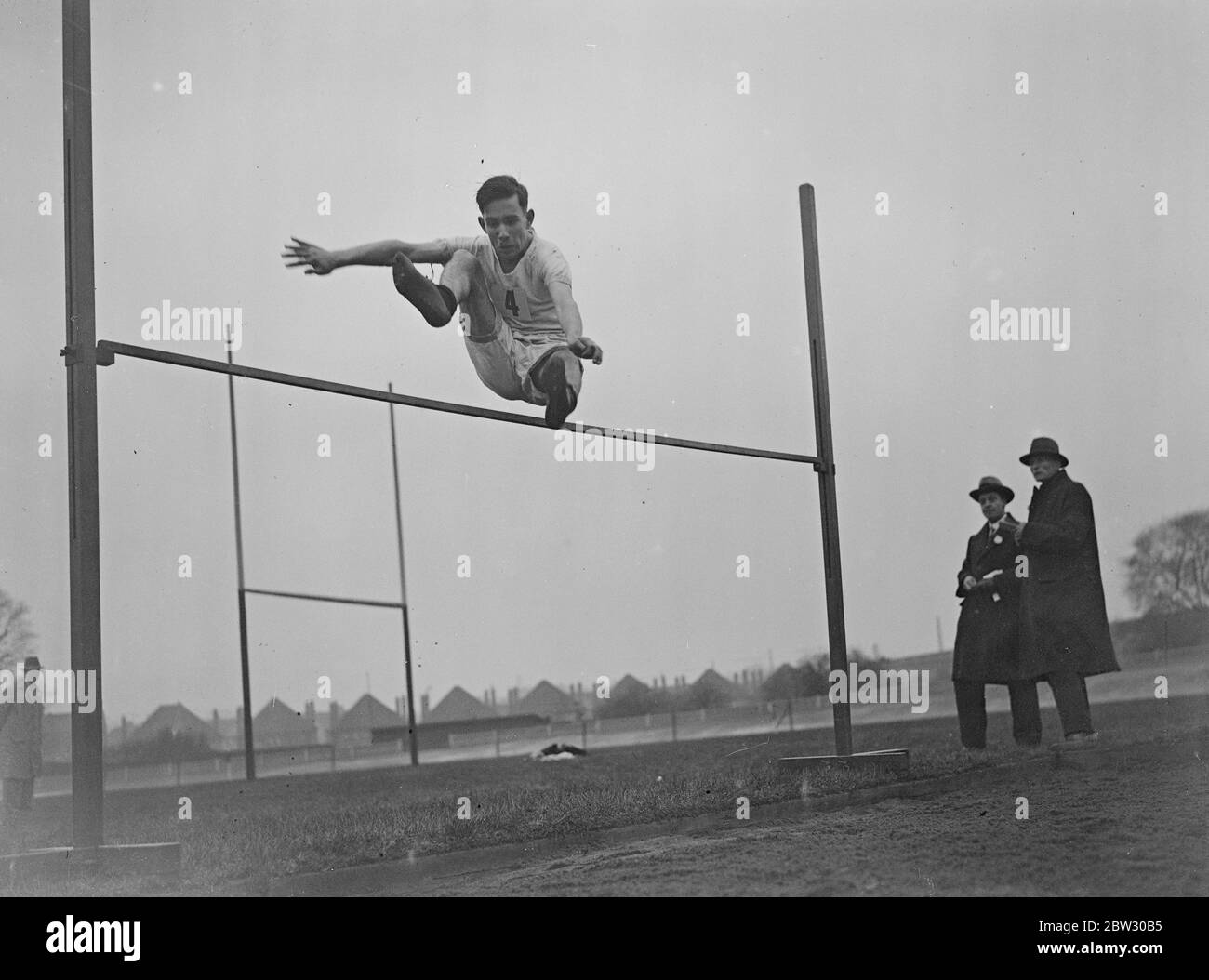 Schoolboy sets new high jump record . H Green set up a new record for the school high jump with 4 ft 8½ inches in the Wilsons Grammar School sports at the Herne Hill track , London . H Green in his record breaking jump . 21 March 1932 Stock Photo