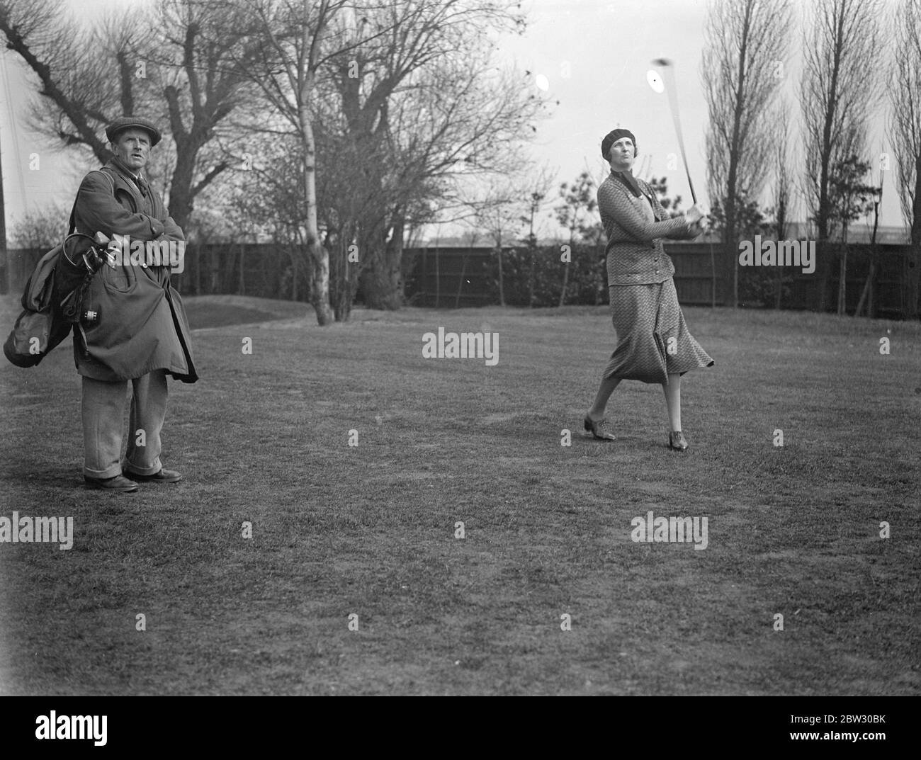 Ladies parliamentary golf tournament opens at Ranelagh . The ladies Parliamentary Golf association held an invitation tournament at Ranelagh Club , London to celebrate the 21 anniversary of the association , many women golfers in Parliamentary circles took part . 8 April 1932 . Stock Photo