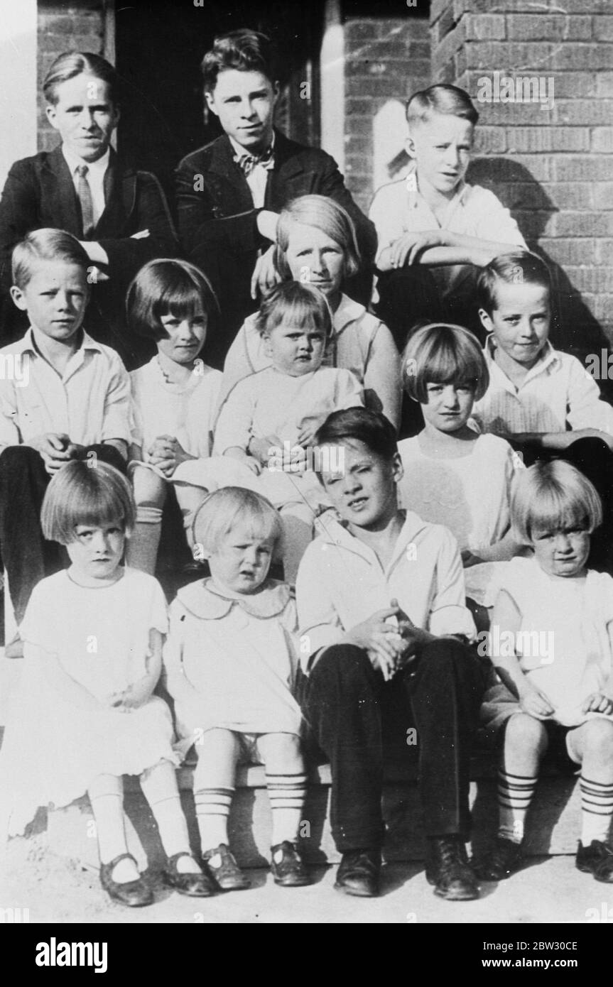 Leading family in race for fortune , left by millionaire to largest family ten years after death . Mrs Florence Brown and her family of thirteen children is the leading party in the race for a fortune of oer £100 , 000 left by Mr Charles Vance Miller , who died in 1926 bequeathing the money to the largest family born 10 years after his death . Mrs Brown has been married 22 years and is 42 years old , and has had 27 children 13 of whom are living . Mr Florence Brown with 12 of her thirteen children . 2 April 1932 Stock Photo