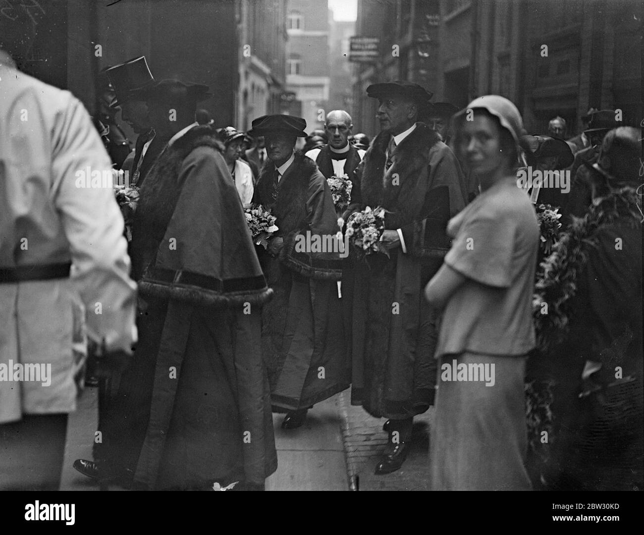 Earl of Athlone takes part as Vintners procession takes place with ancient ceremony . The annual Vintners company procession from the Vintners Hall , Lower Thames Street , London , to the church of St Michael , Paternoster Royal , took place with the customary ceremony dating back to the plague of London . Men with brooms swept the street and sprinkled herbs along the route , a relic of the plkague . the Earl of Athlone , who is the Rental Warden this year , walked in the procession . The Earl of Athlone walking in the procession behind the new Master of the Company , Mr James Henry Todd . 14 Stock Photo