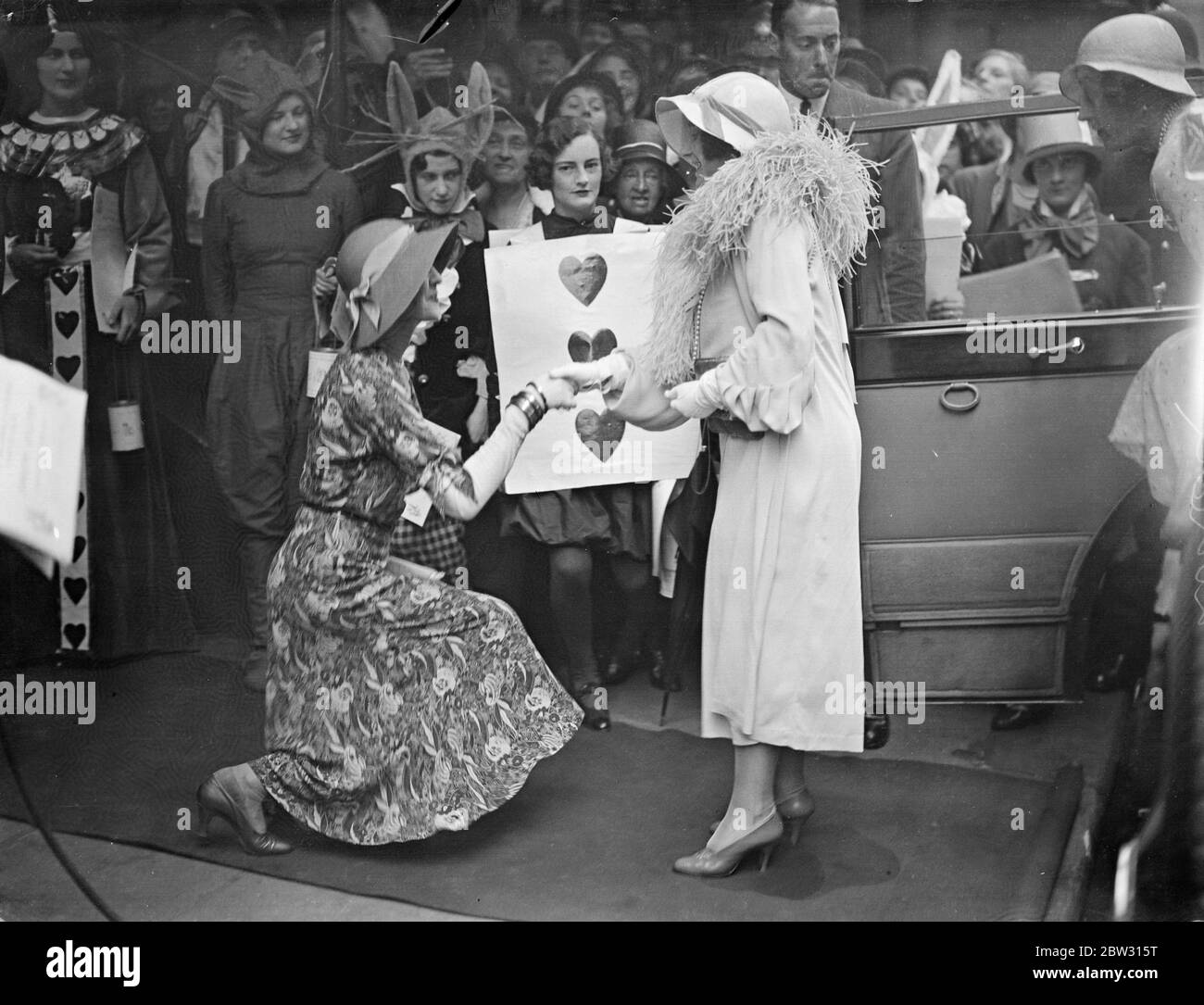 Duchess of York attends Lewis Carroll Matinee at St James Theatre . The Duchess of York attended the Lewis Carroll Centenary Matinee at St James Theatre , London . The Duchess of York being received by Lady Mount Temple at the theatre . 12 July 1932 Stock Photo